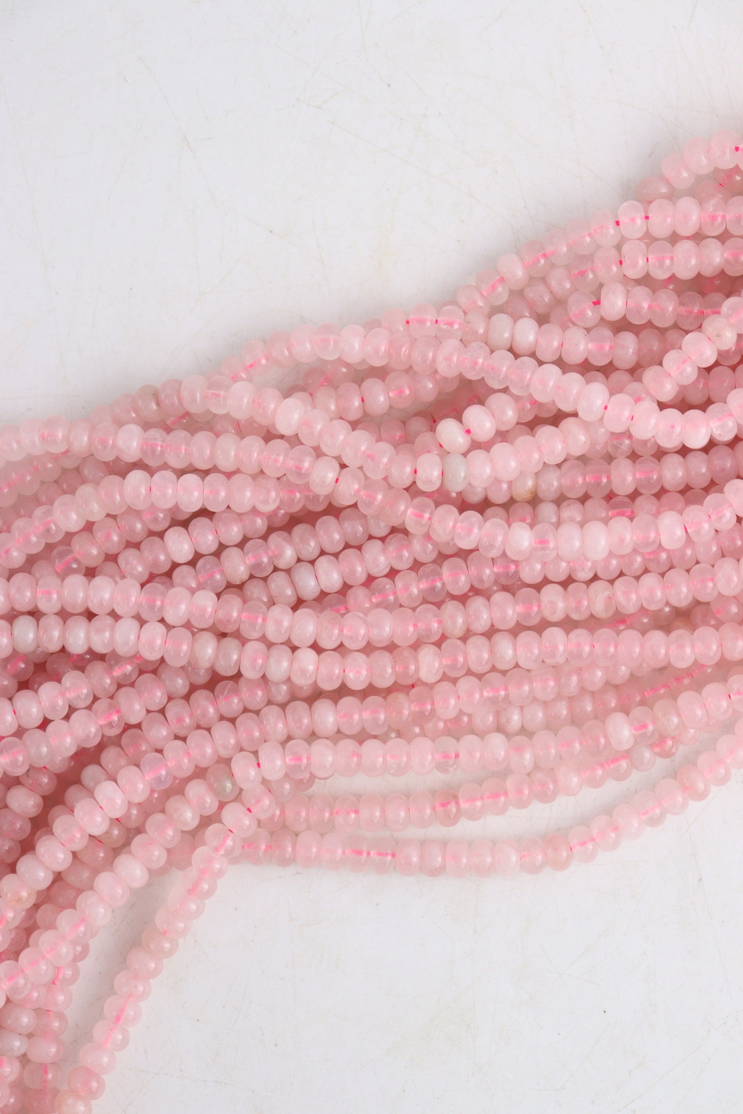 Wholesale Rose Quartz 5x8 mm Flat Beads | Mi Esperanza Minerals | Supplier of Crystals and Onyx
