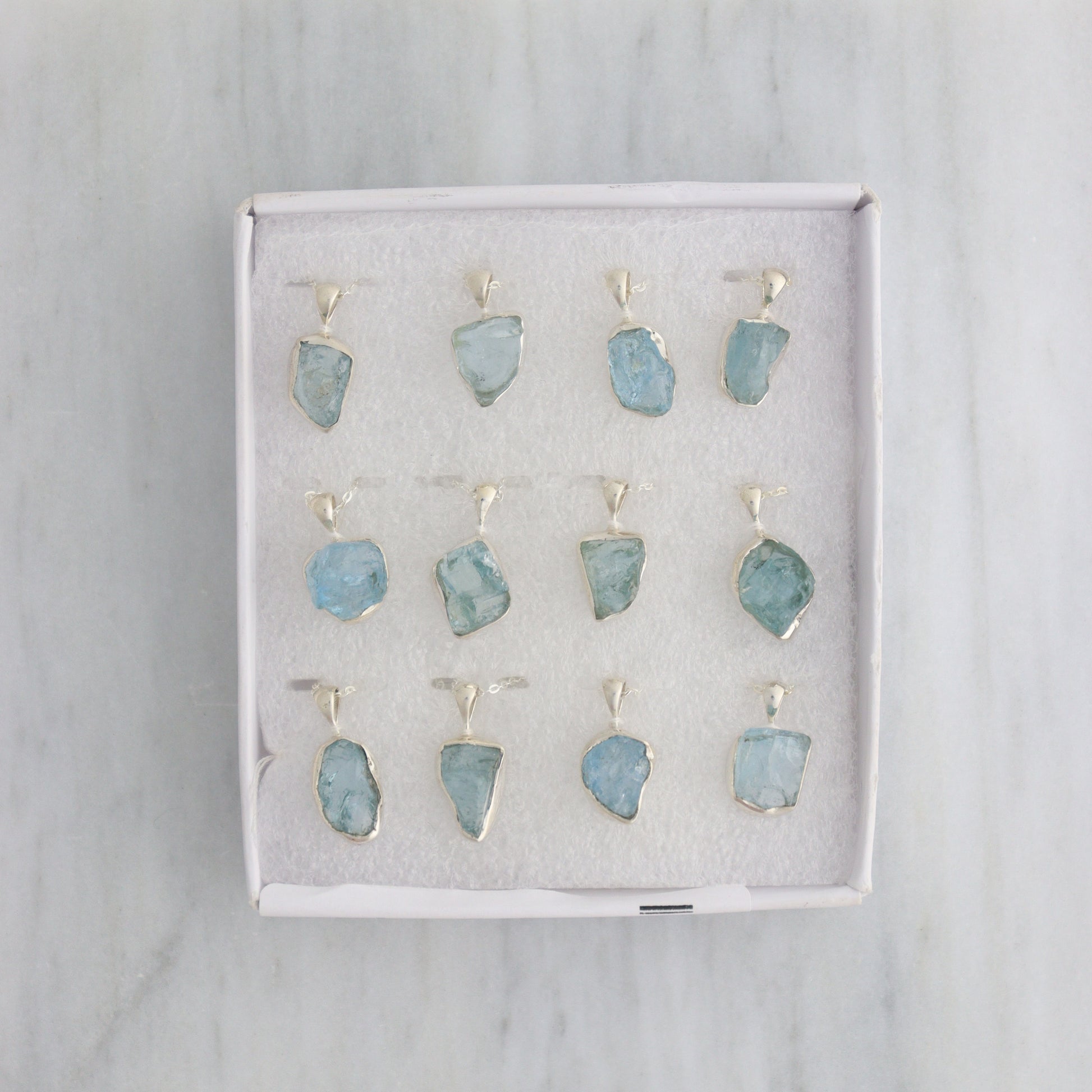 Aquamarine Pendants Set of 12 with Chains - Mi Esperanza Minerals