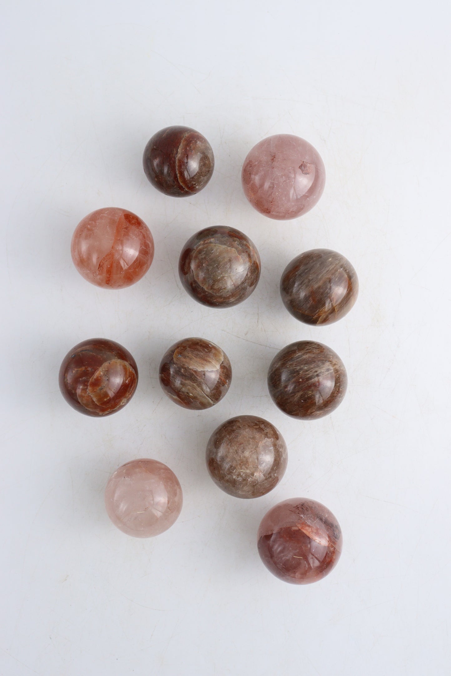 Fire Quartz Spheres Set of 11 - Expert Supplier of Wholesale Crystals & Bulk Gemstones