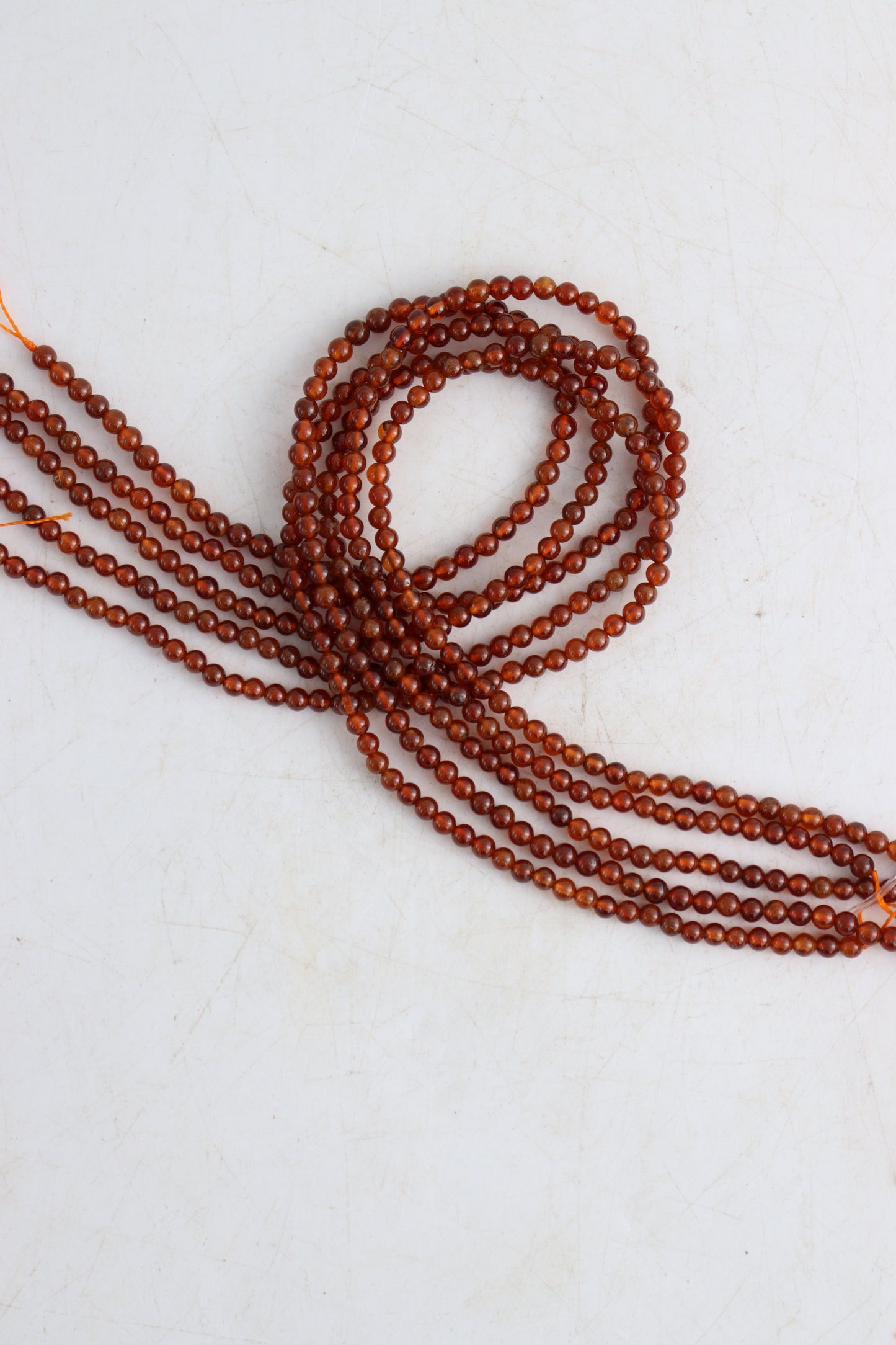 Hessonite Garnet 4mm Round Beads - Expert Wholesale and Supplier of Wholesale Crystals & Bulk Gemstones, []
