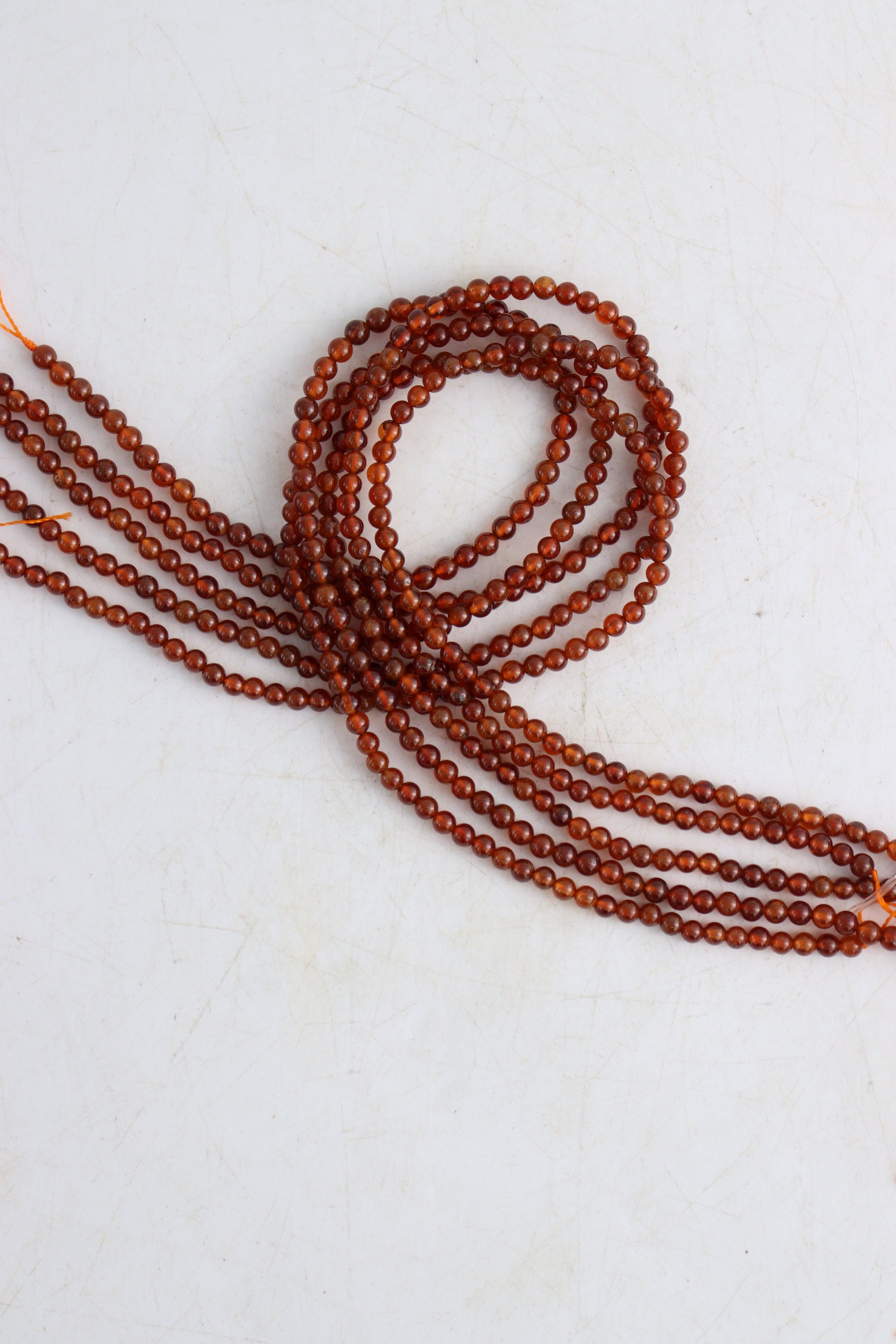 Hessonite Garnet 4mm Round Beads - Expert Wholesale and Supplier of Wholesale Crystals & Bulk Gemstones, []