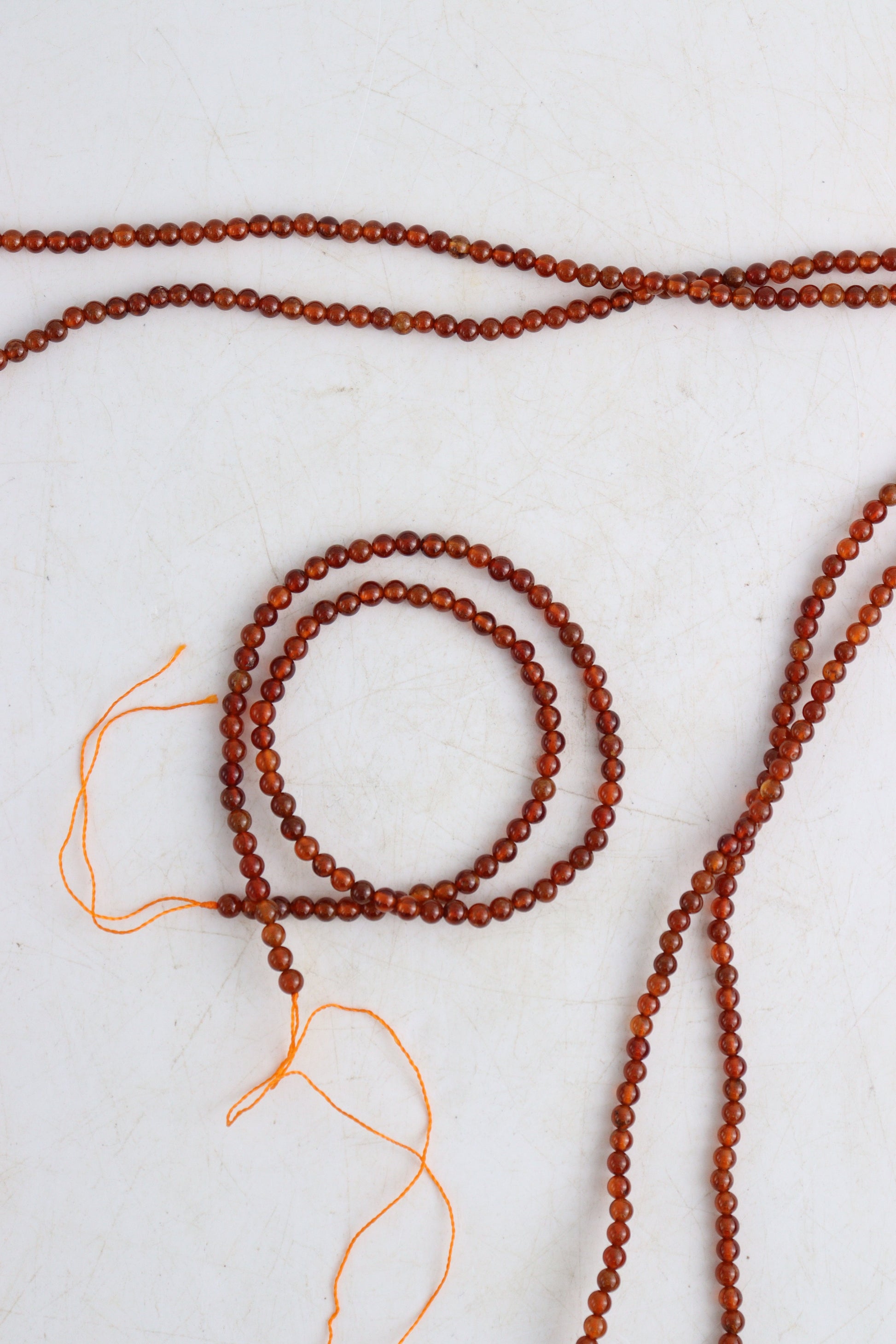Hessonite Garnet 4mm Round Beads - Expert Wholesale and Supplier of Wholesale Crystals & Bulk Gemstones, []