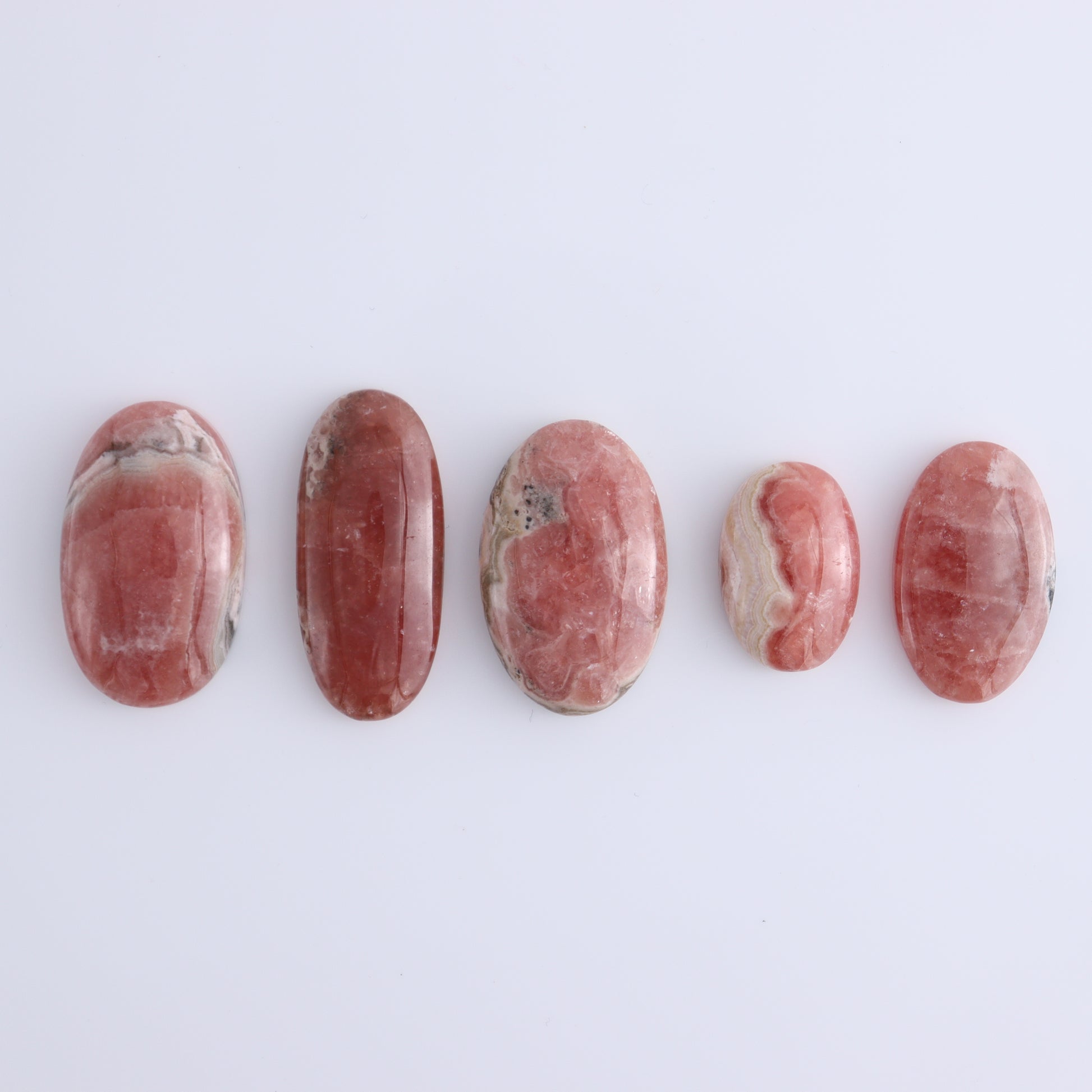 Rhodochrosite Oval Cabs Set of 8 - Expert Wholesale and Supplier of Wholesale Crystals & Bulk Gemstones, ["Argentina","Cabs","Oval","Rhodochrosite"]