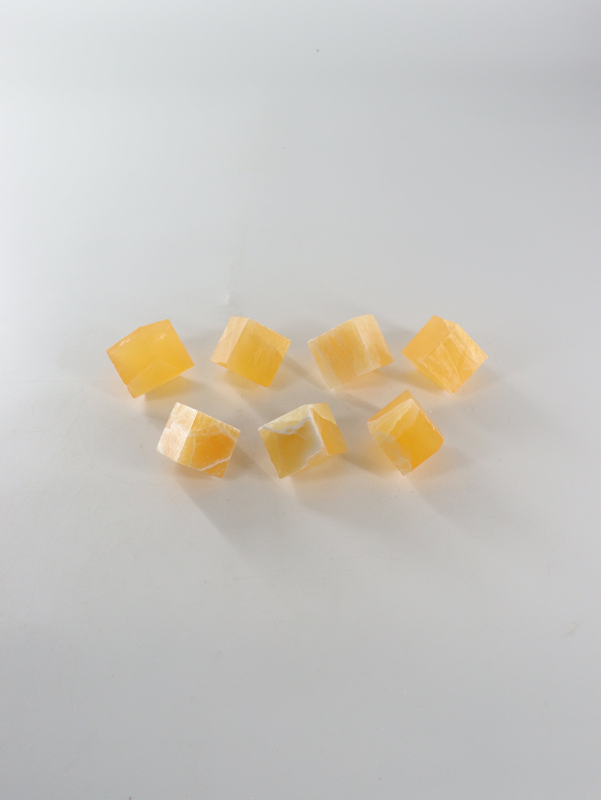 Calcite Cubes Set of 7 - Expert Wholesale and Supplier of Wholesale Crystals & Bulk Gemstones, ["Calcite","close_50","Flats","Freeforms","Honey Calcite","Utah"]