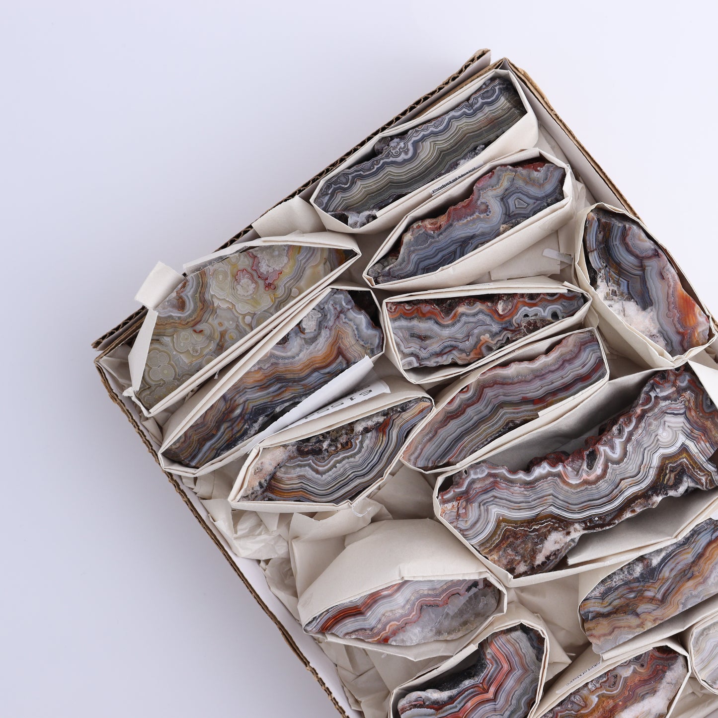 Crazy Lace Agate Flat of 14 - Expert Wholesale and Supplier of Wholesale Crystals & Bulk Gemstones, ["Crazy Lace Agate","Mexico"]