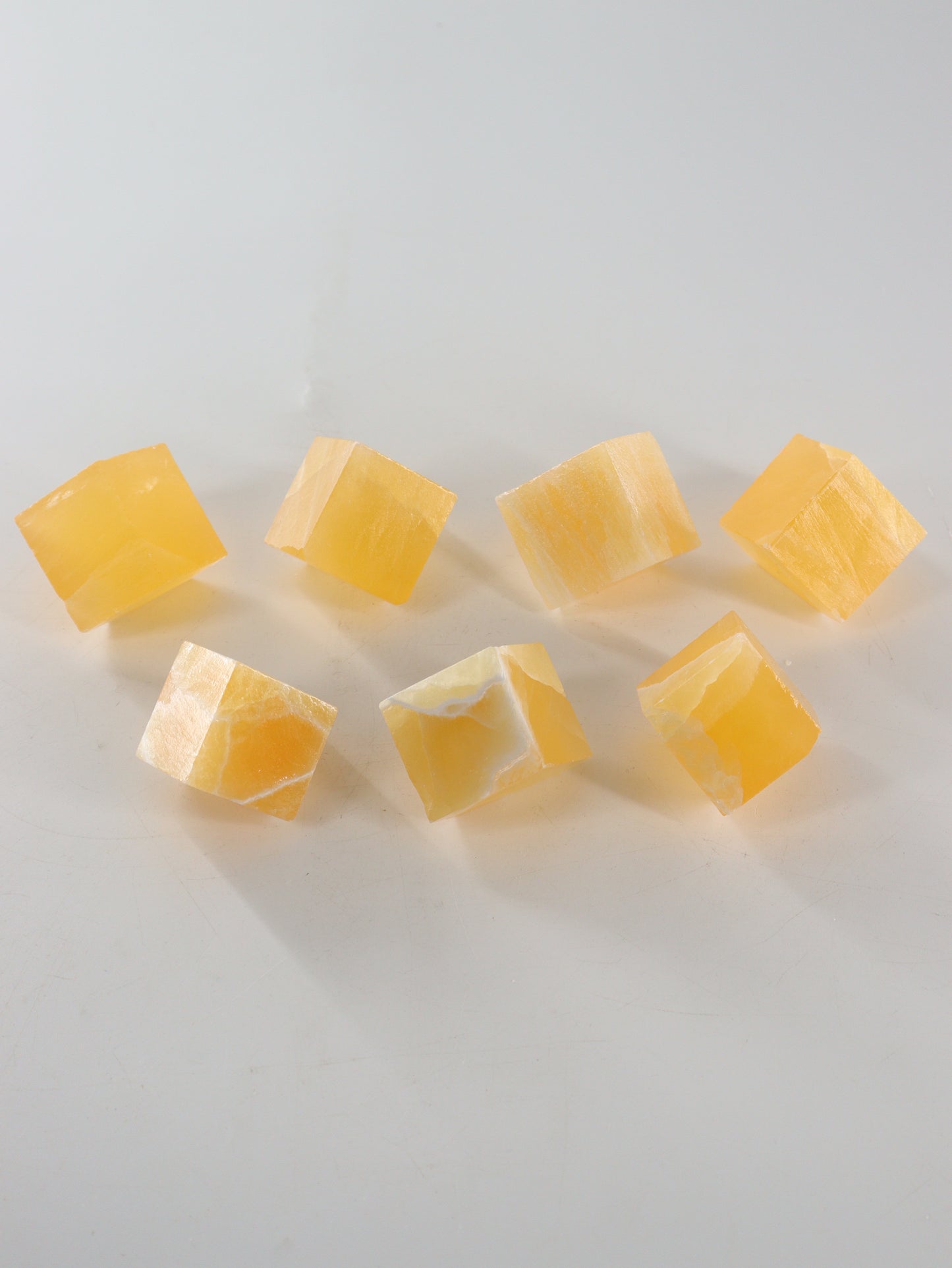 Calcite Cubes Set of 7 - Expert Wholesale and Supplier of Wholesale Crystals & Bulk Gemstones, ["Calcite","close_50","Flats","Freeforms","Honey Calcite","Utah"]