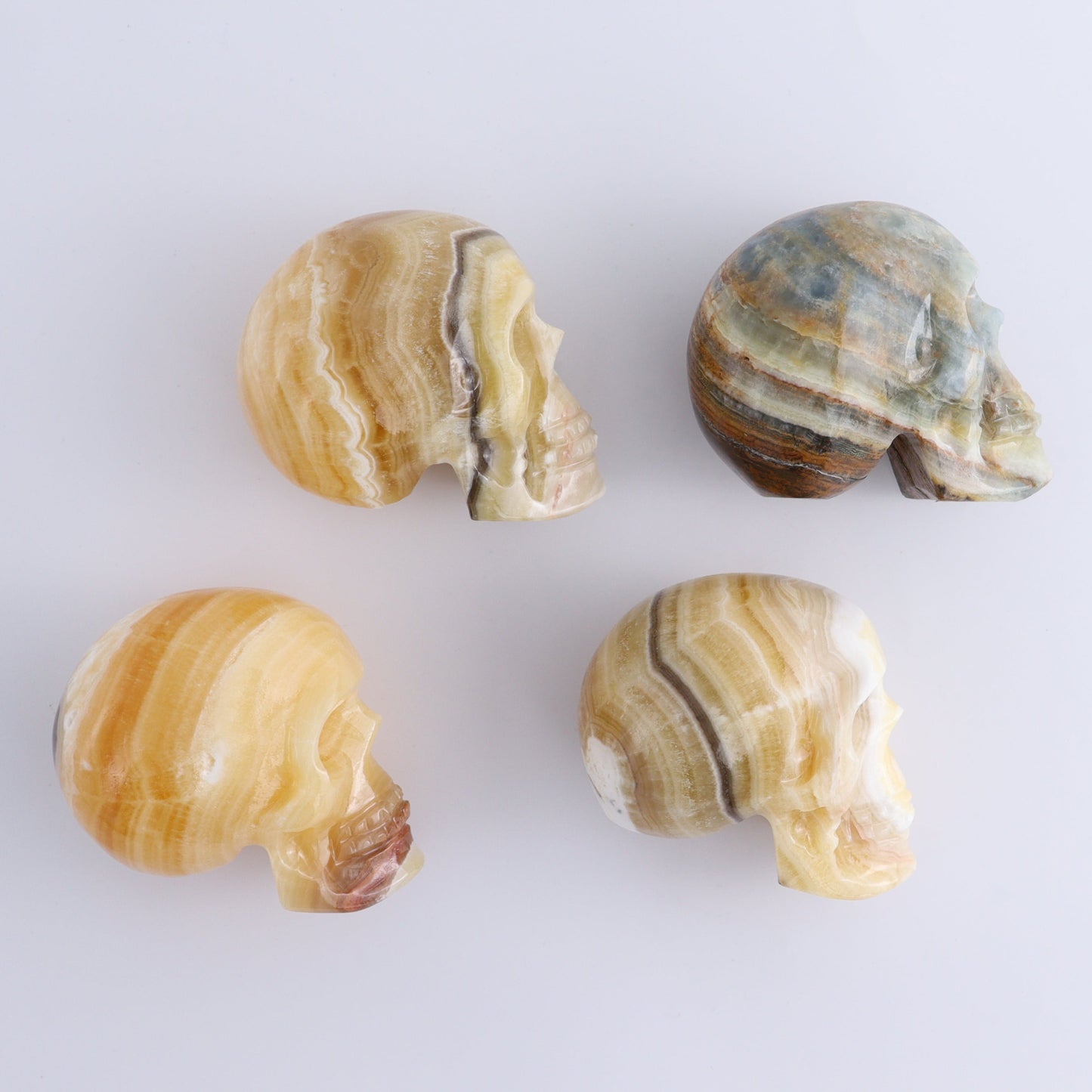 Onyx Skulls Set of 4 - Expert Wholesale and Supplier of Wholesale Crystals & Bulk Gemstones, ["Mexico","onyx","Skulls"]