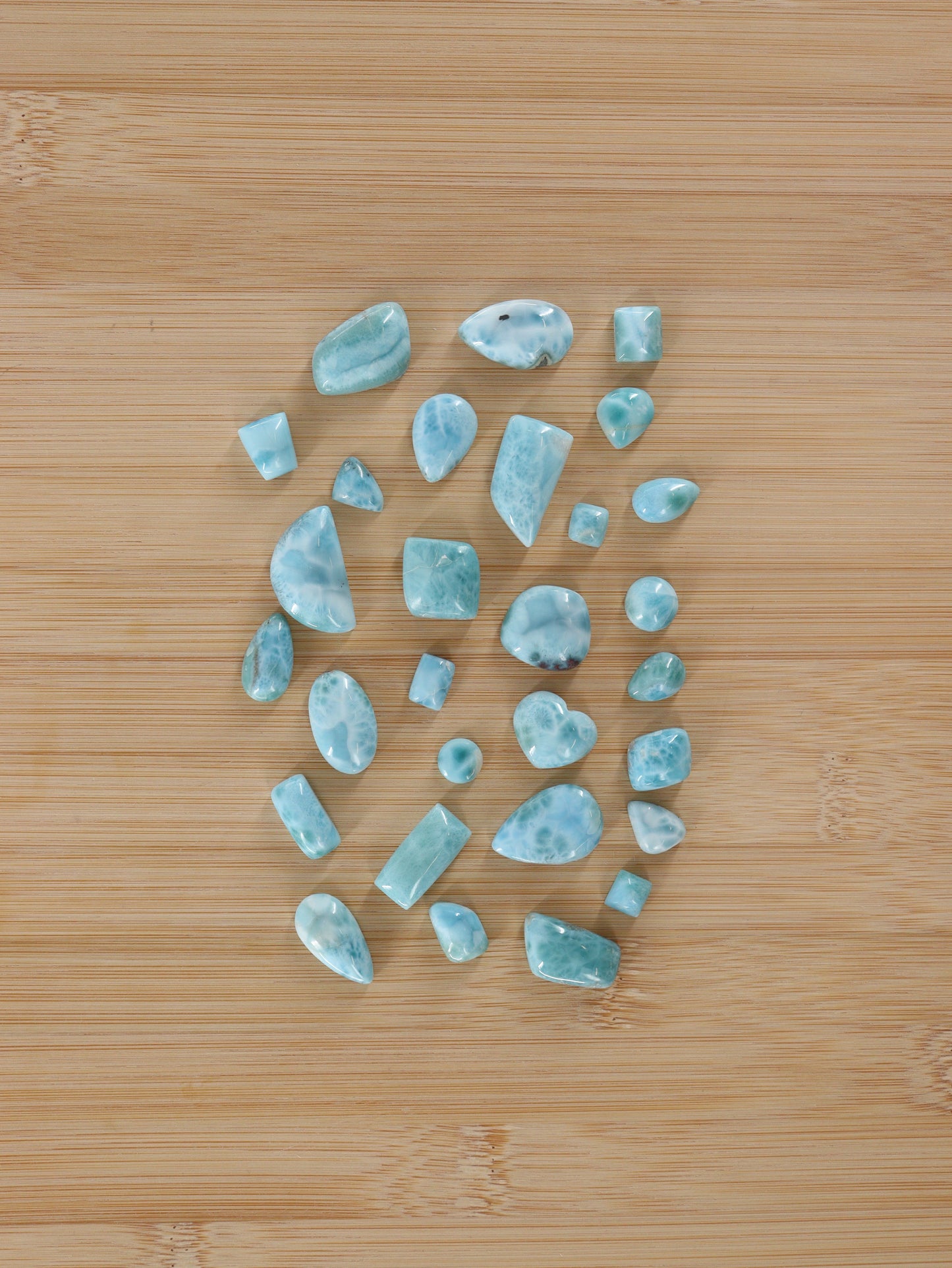 Larimar Cabs Set of 29 - Expert Wholesale and Supplier of Wholesale Crystals & Bulk Gemstones, ["Cabs","Larimar","Mixed Carvings"]