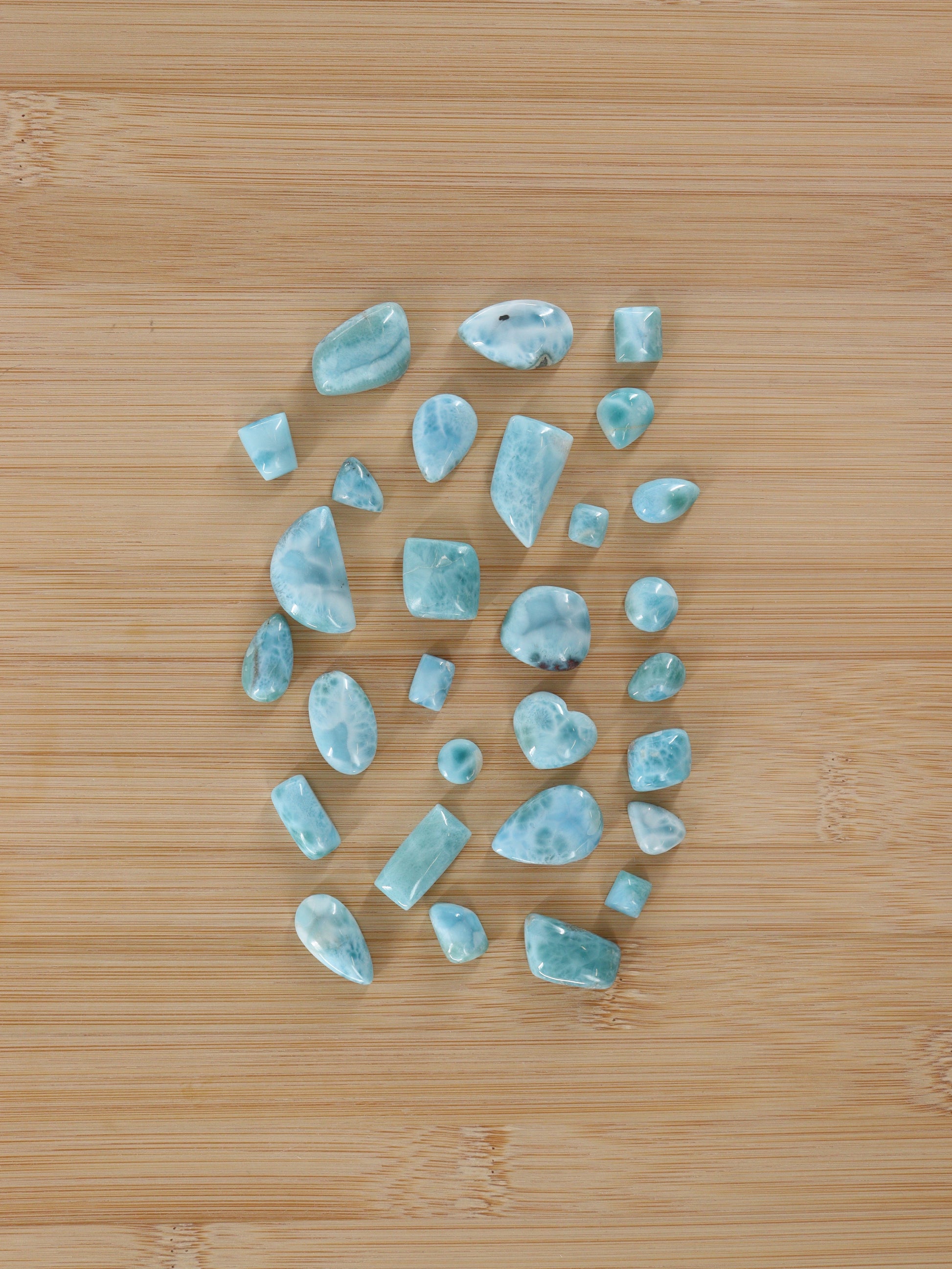 Larimar Cabs Set of 29 - Expert Wholesale and Supplier of Wholesale Crystals & Bulk Gemstones, ["Cabs","Larimar","Mixed Carvings"]
