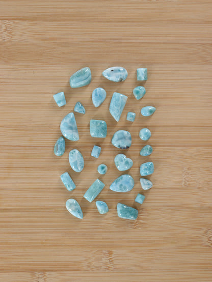 Larimar Cabs Set of 29 - Expert Wholesale and Supplier of Wholesale Crystals & Bulk Gemstones, ["Cabs","Larimar","Mixed Carvings"]