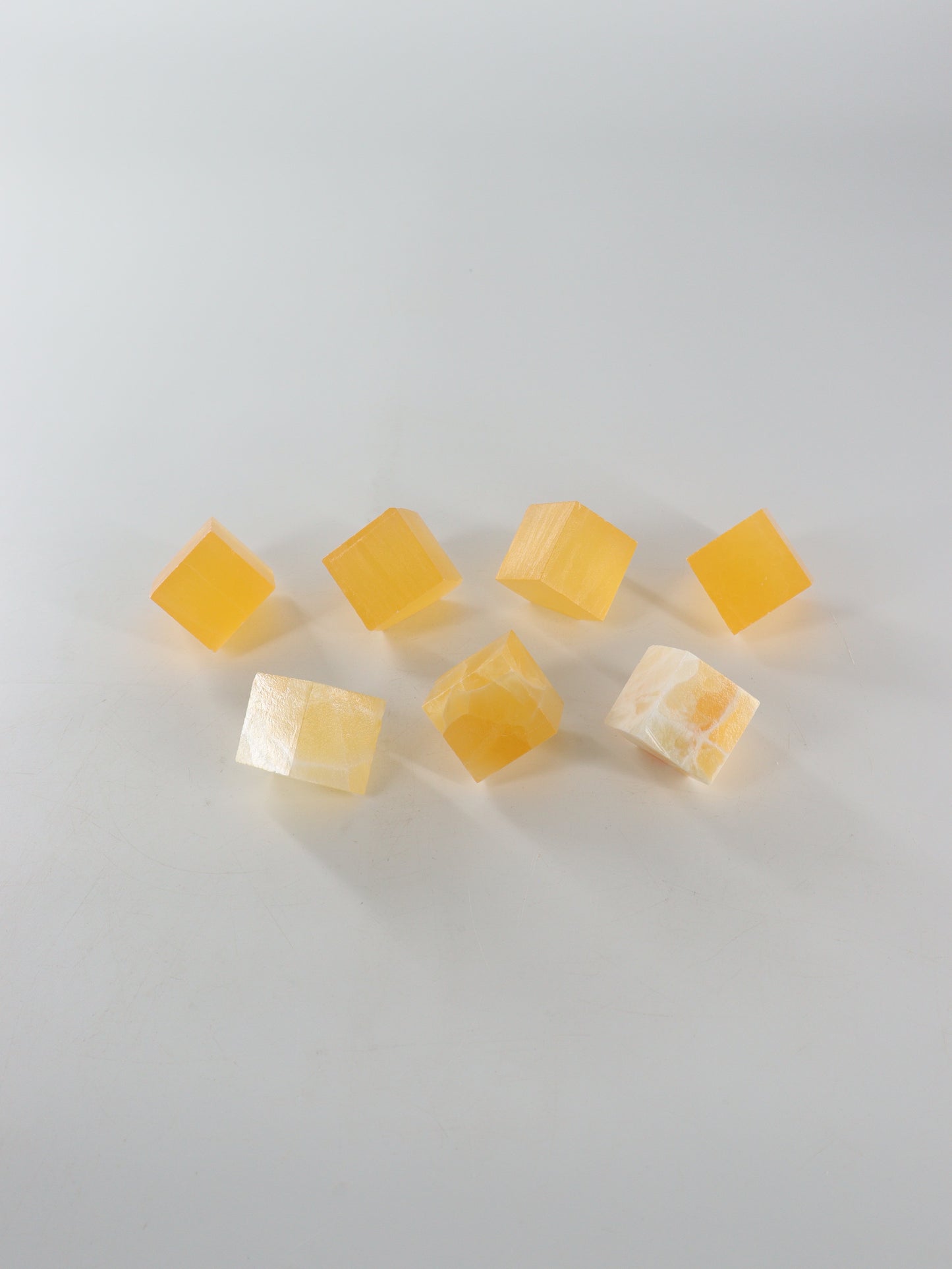 Calcite Cubes Set of 7 - Expert Wholesale and Supplier of Wholesale Crystals & Bulk Gemstones, ["Calcite","close_50","Flats","Freeforms","Honey Calcite","Utah"]