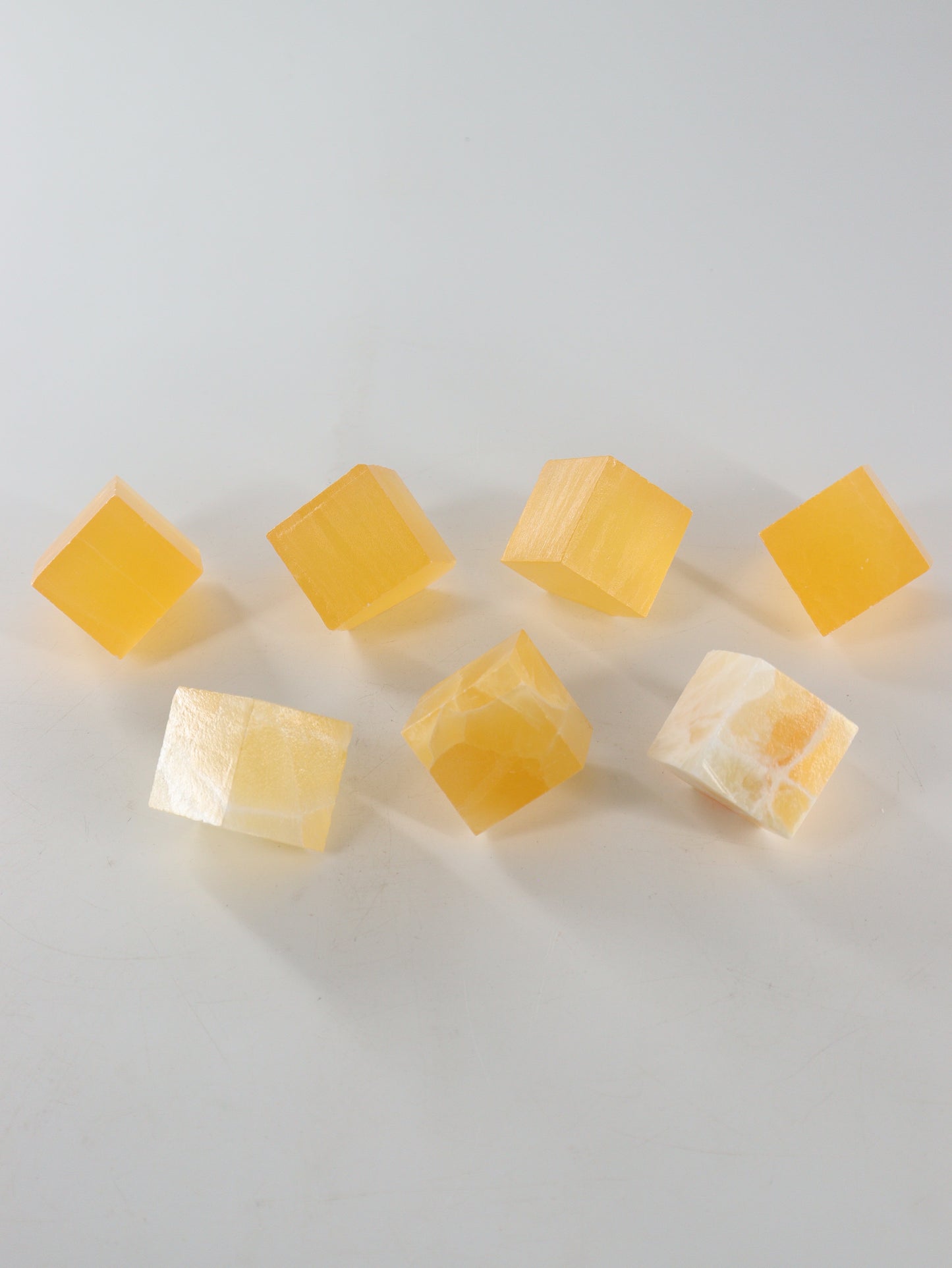 Calcite Cubes Set of 7 - Expert Wholesale and Supplier of Wholesale Crystals & Bulk Gemstones, ["Calcite","close_50","Flats","Freeforms","Honey Calcite","Utah"]