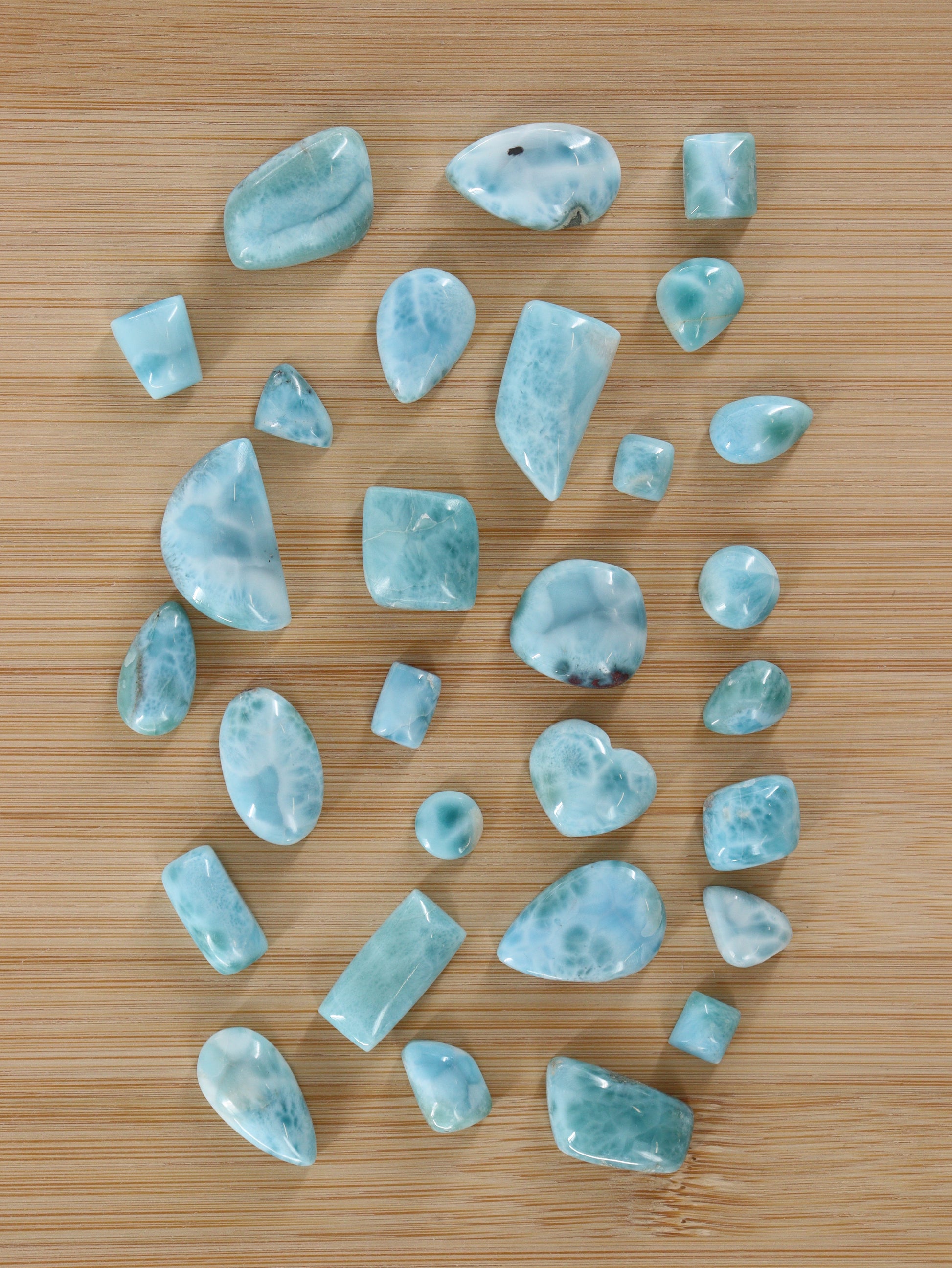 Larimar Cabs Set of 29 - Expert Wholesale and Supplier of Wholesale Crystals & Bulk Gemstones, ["Cabs","Larimar","Mixed Carvings"]