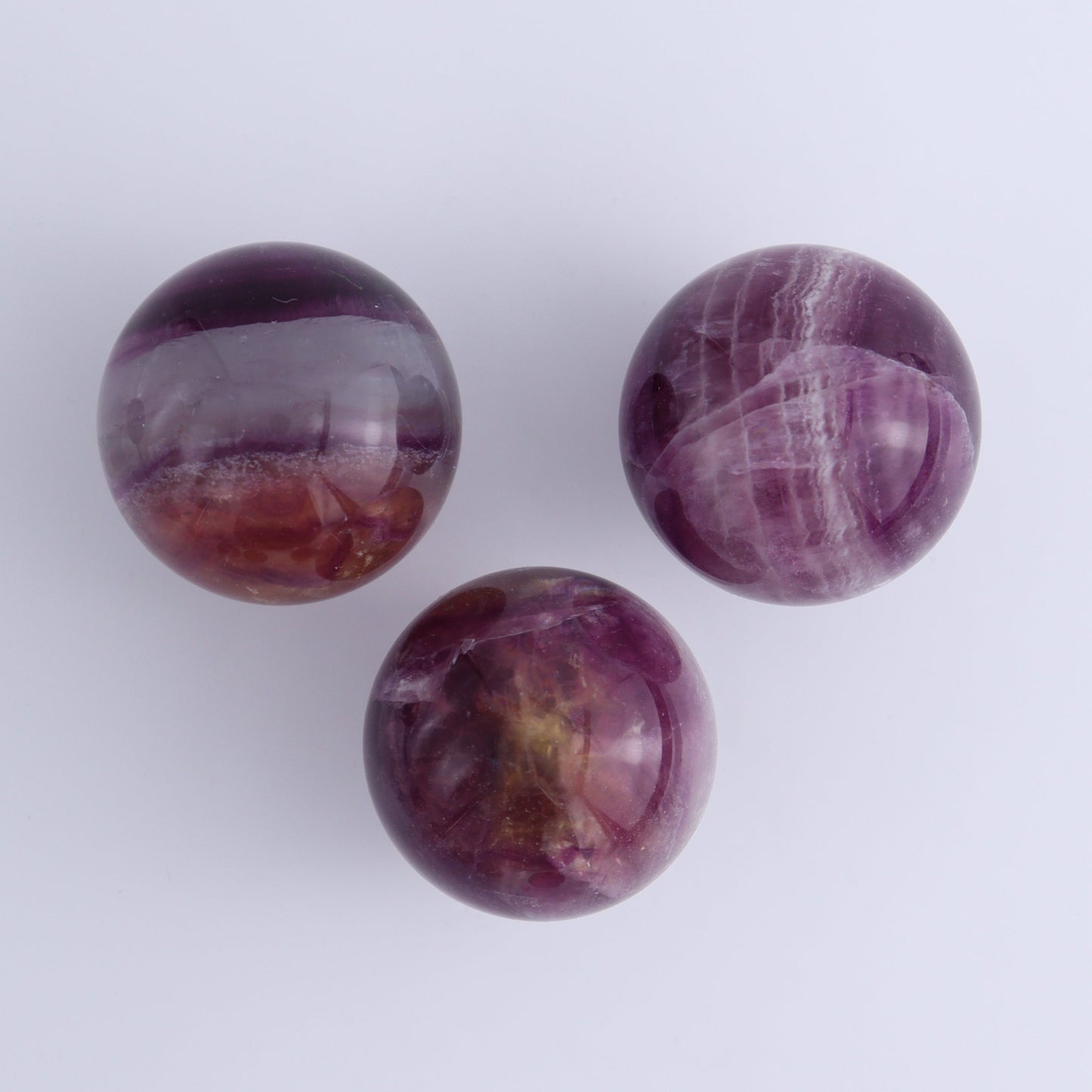 Purple Fluorite Spheres Set of 9 - Expert Wholesale and Supplier of Wholesale Crystals & Bulk Gemstones, ["Fluorite","Purple Fluorite","Spheres"]