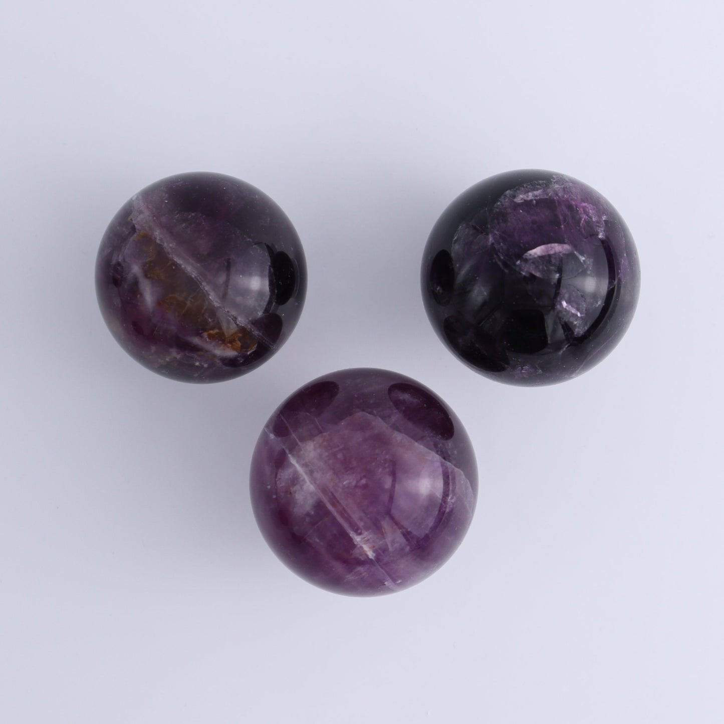 Purple Fluorite Spheres Set of 9 - Expert Wholesale and Supplier of Wholesale Crystals & Bulk Gemstones, ["Fluorite","Purple Fluorite","Spheres"]