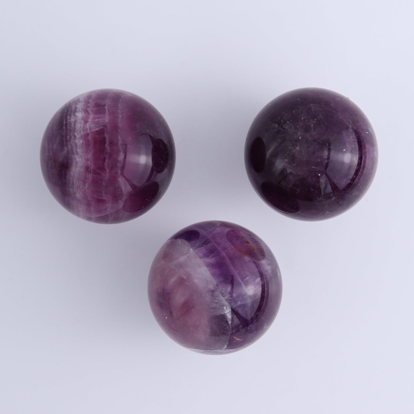Purple Fluorite Spheres Set of 9 - Expert Wholesale and Supplier of Wholesale Crystals & Bulk Gemstones, ["Fluorite","Purple Fluorite","Spheres"]