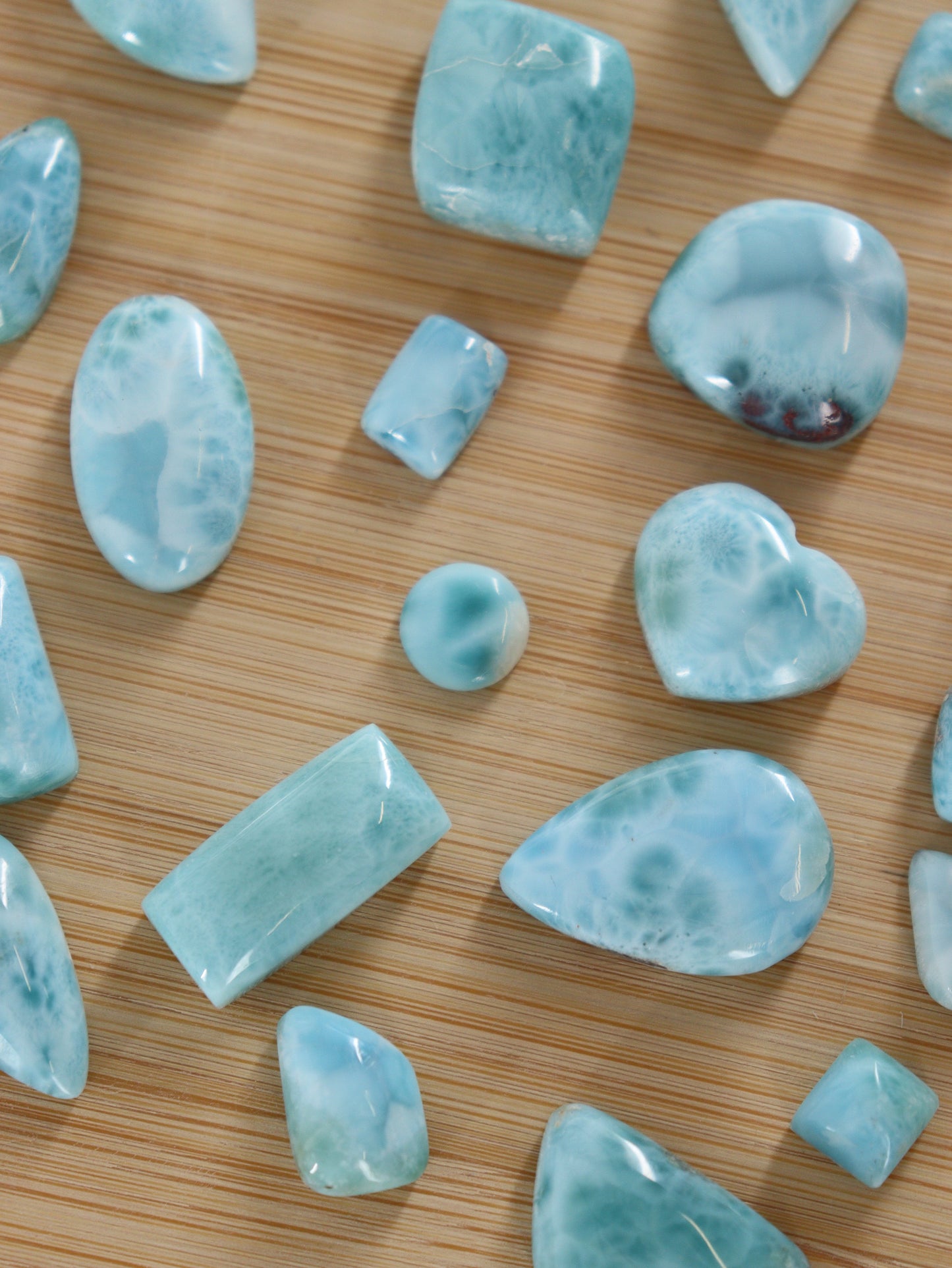 Larimar Cabs Set of 29 - Expert Wholesale and Supplier of Wholesale Crystals & Bulk Gemstones, ["Cabs","Larimar","Mixed Carvings"]