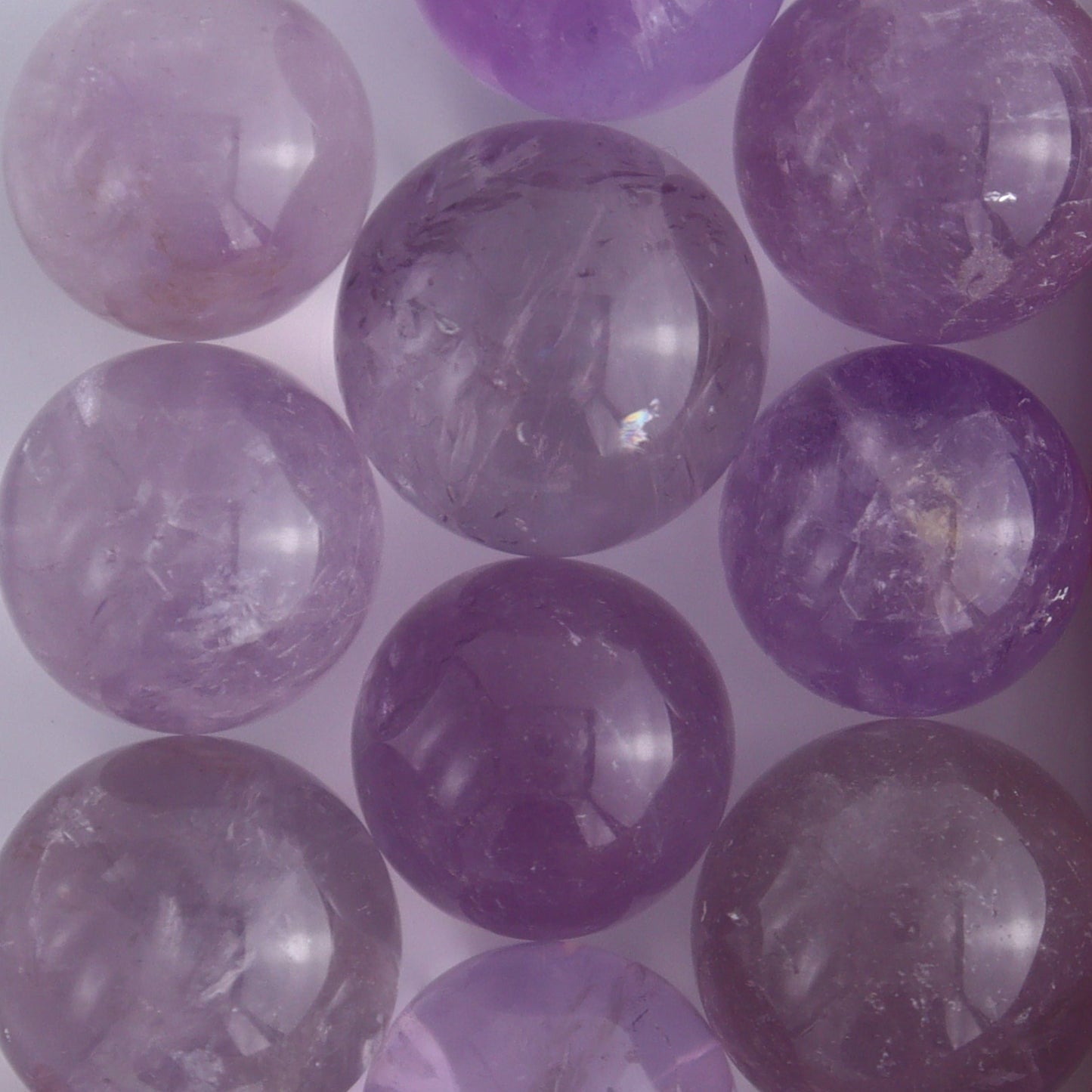 Clear Amethyst Spheres 10 Piece Set - Expert Wholesale and Supplier of Wholesale Crystals & Bulk Gemstones, ["Amethyst","Clear Quartz","Spheres"]