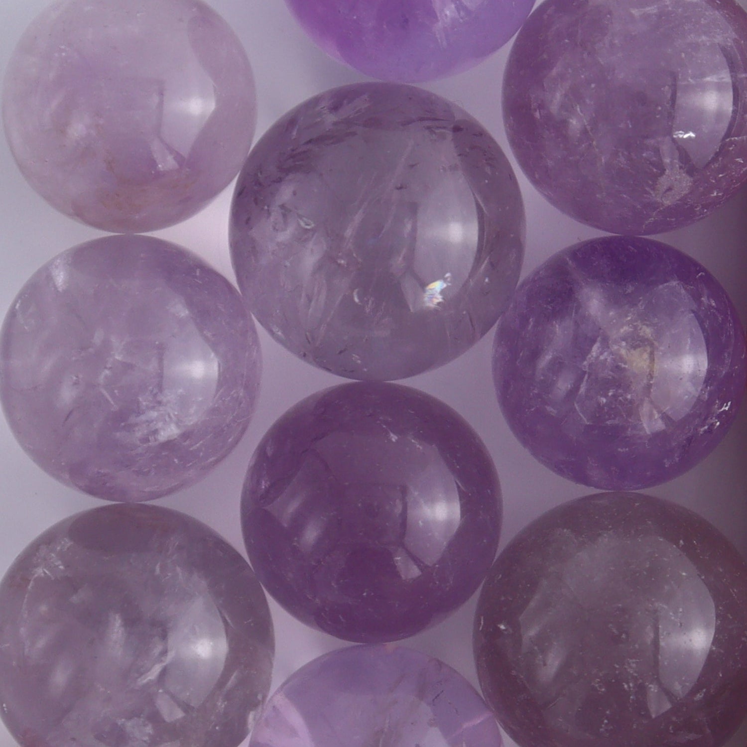 Clear Amethyst Spheres 10 Piece Set - Expert Wholesale and Supplier of Wholesale Crystals & Bulk Gemstones, ["Amethyst","Clear Quartz","Spheres"]