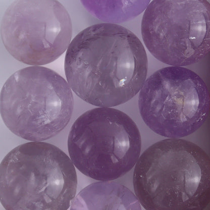 Clear Amethyst Spheres 10 Piece Set - Expert Wholesale and Supplier of Wholesale Crystals & Bulk Gemstones, ["Amethyst","Clear Quartz","Spheres"]