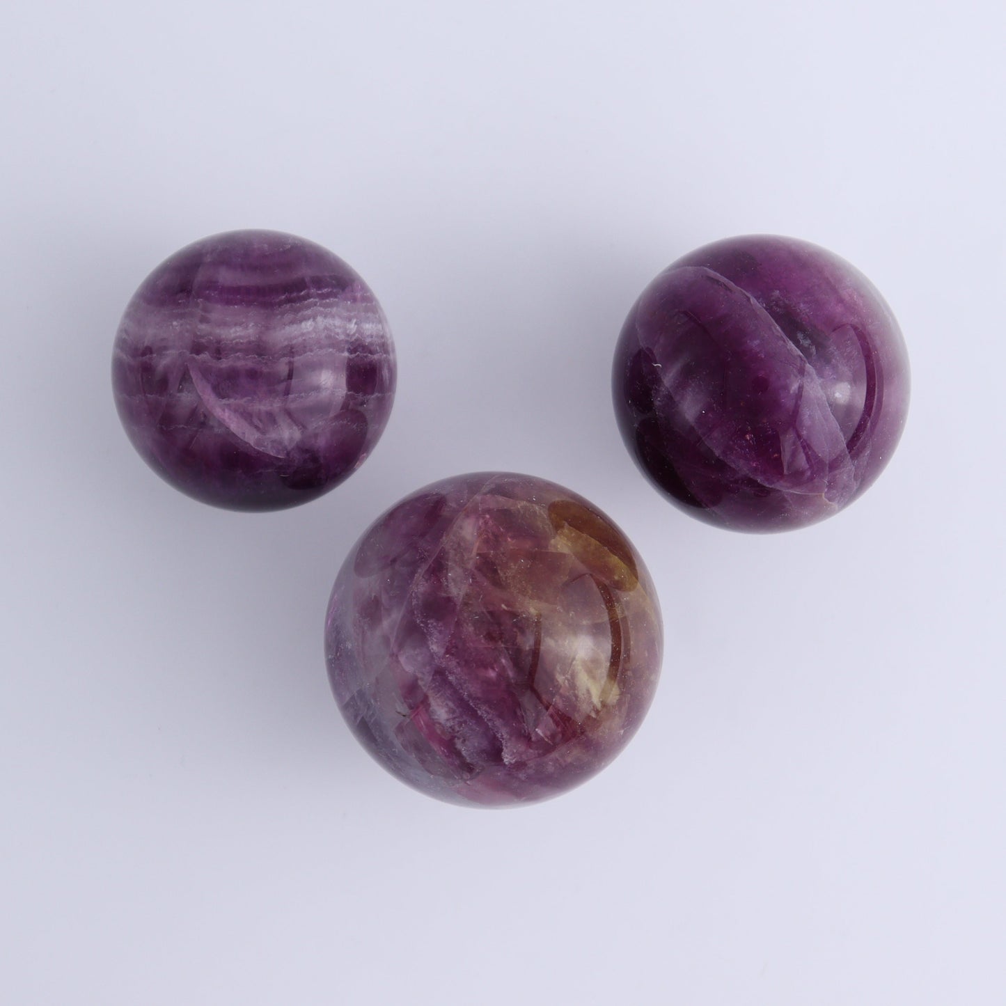 Purple Fluorite Spheres Set of 9 - Expert Wholesale and Supplier of Wholesale Crystals & Bulk Gemstones, ["Fluorite","Purple Fluorite","Spheres"]