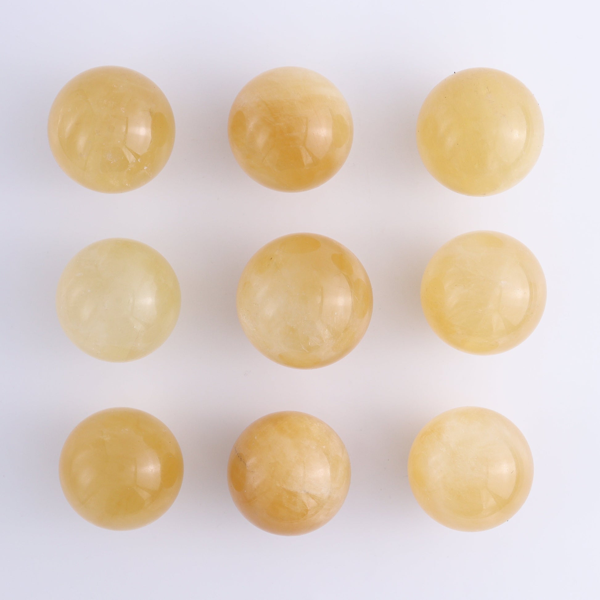Calcite Spheres Set of 9 - Expert Wholesale and Supplier of Wholesale Crystals & Bulk Gemstones, ["Calcite","Mexico","Spheres"]
