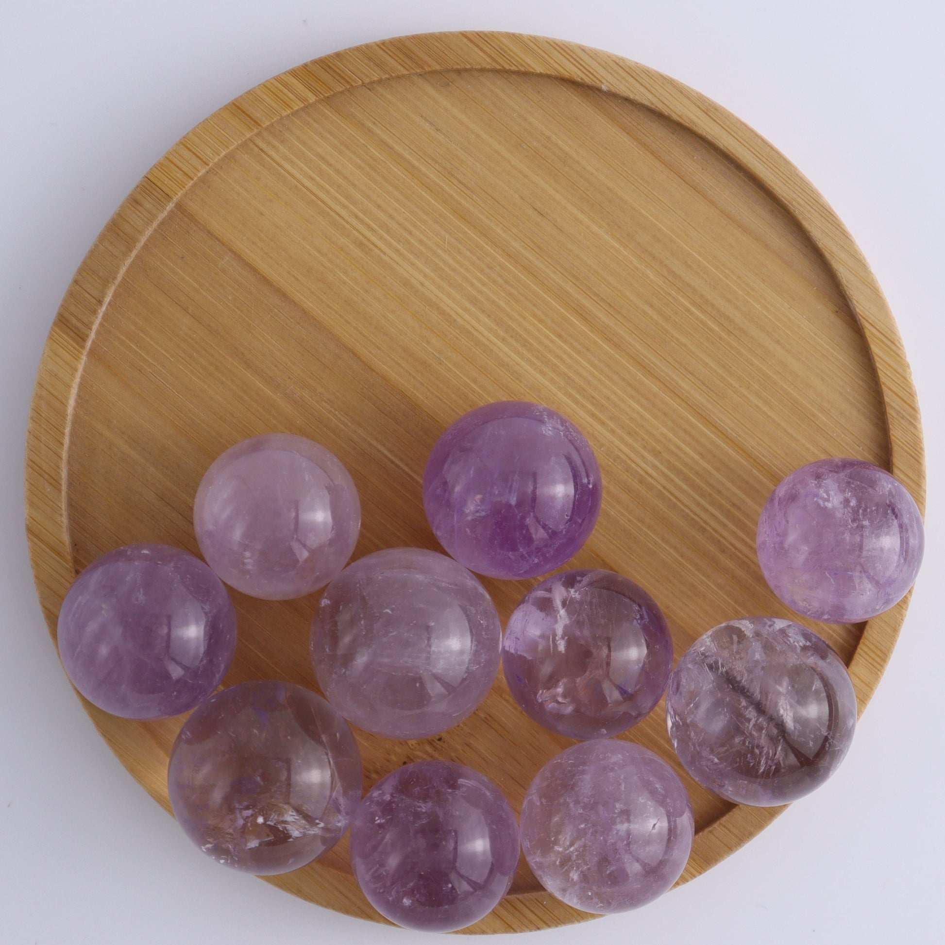 Clear Amethyst Spheres 10 Piece Set - Expert Wholesale and Supplier of Wholesale Crystals & Bulk Gemstones, ["Amethyst","Clear Quartz","Spheres"]