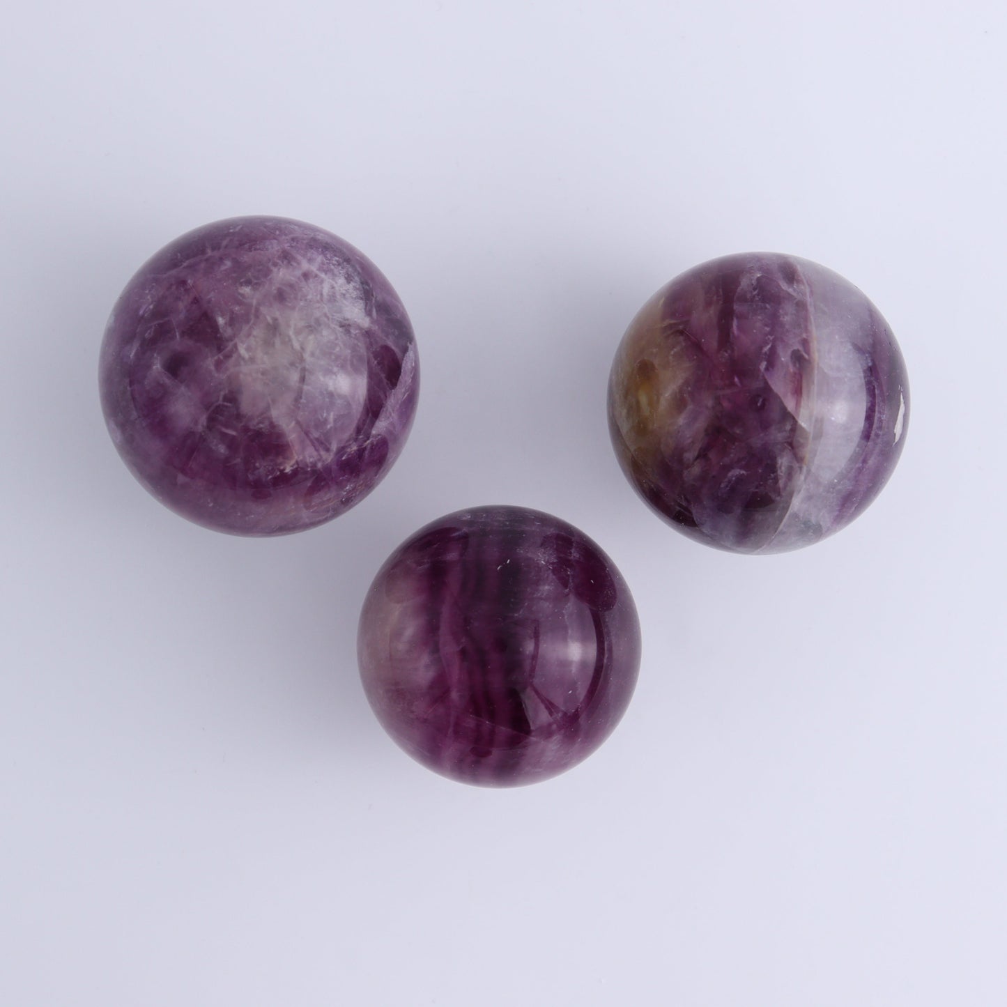 Purple Fluorite Spheres Set of 9 - Expert Wholesale and Supplier of Wholesale Crystals & Bulk Gemstones, ["Fluorite","Purple Fluorite","Spheres"]