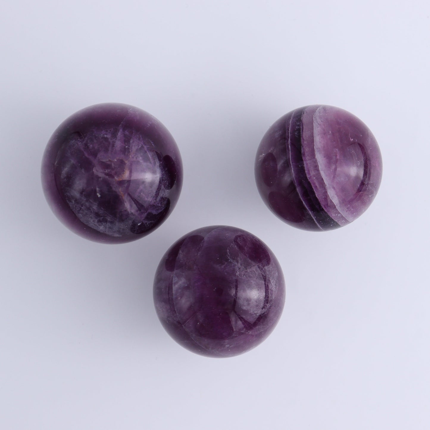 Purple Fluorite Spheres Set of 9 - Expert Wholesale and Supplier of Wholesale Crystals & Bulk Gemstones, ["Fluorite","Purple Fluorite","Spheres"]