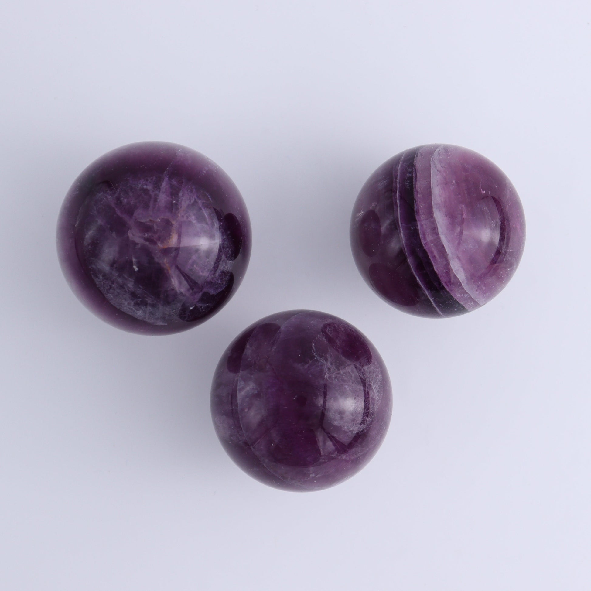 Purple Fluorite Spheres Set of 9 - Expert Wholesale and Supplier of Wholesale Crystals & Bulk Gemstones, ["Fluorite","Purple Fluorite","Spheres"]