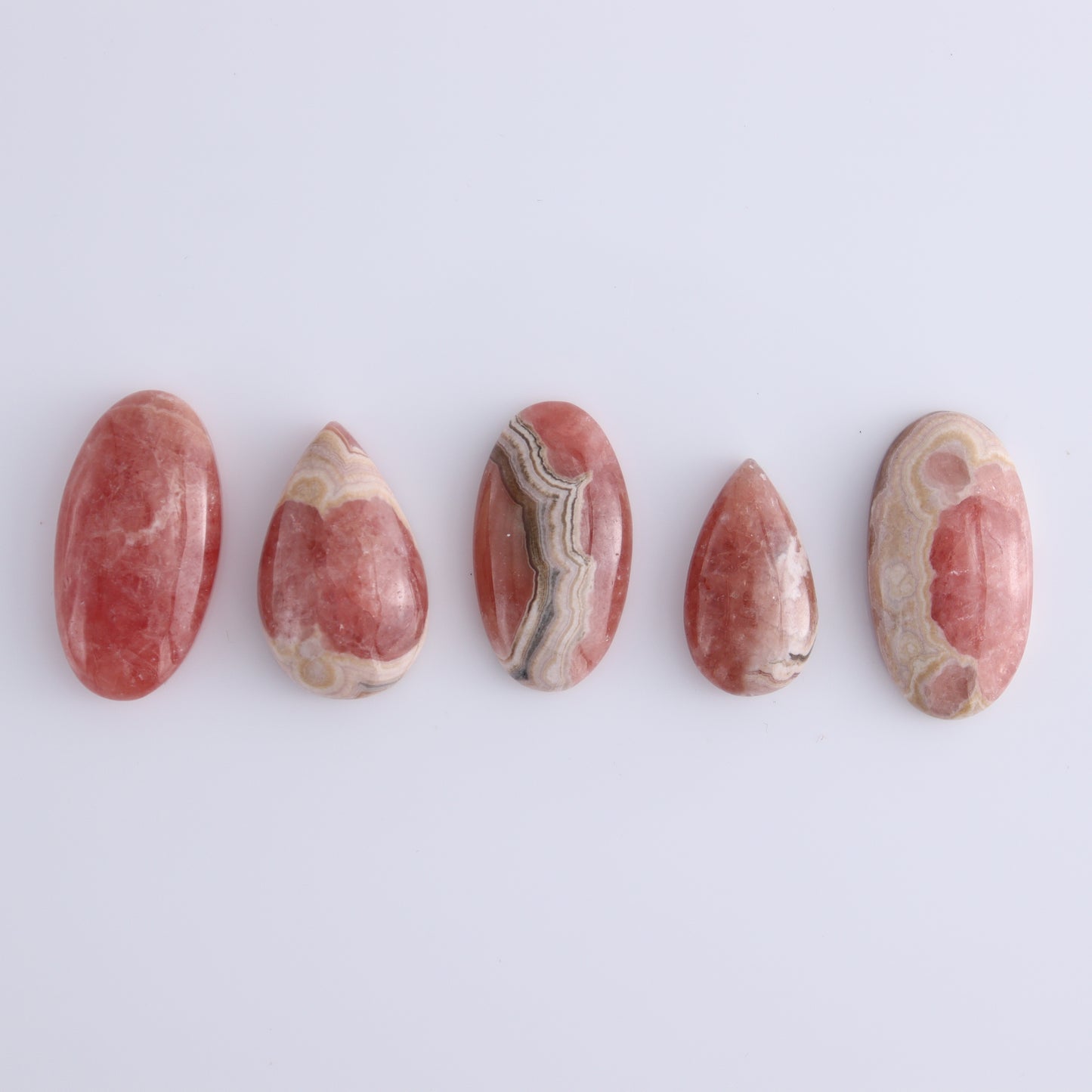 Rhodochrosite Cabs Set of 8 - Expert Wholesale and Supplier of Wholesale Crystals & Bulk Gemstones, ["Argentina","Cabs","Oval","Rhodochrosite"]