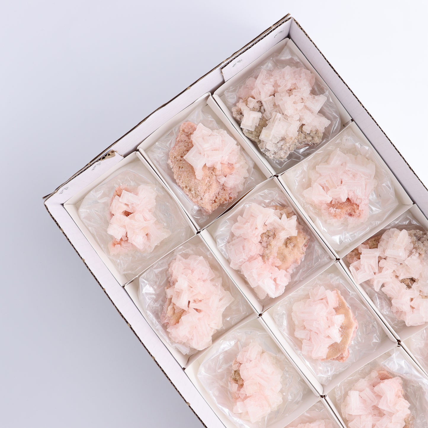 Searles Lake Halite Flat of 12 - Expert Wholesale and Supplier of Wholesale Crystals & Bulk Gemstones, ["close_30","Halite","Pink Halite","United States"]