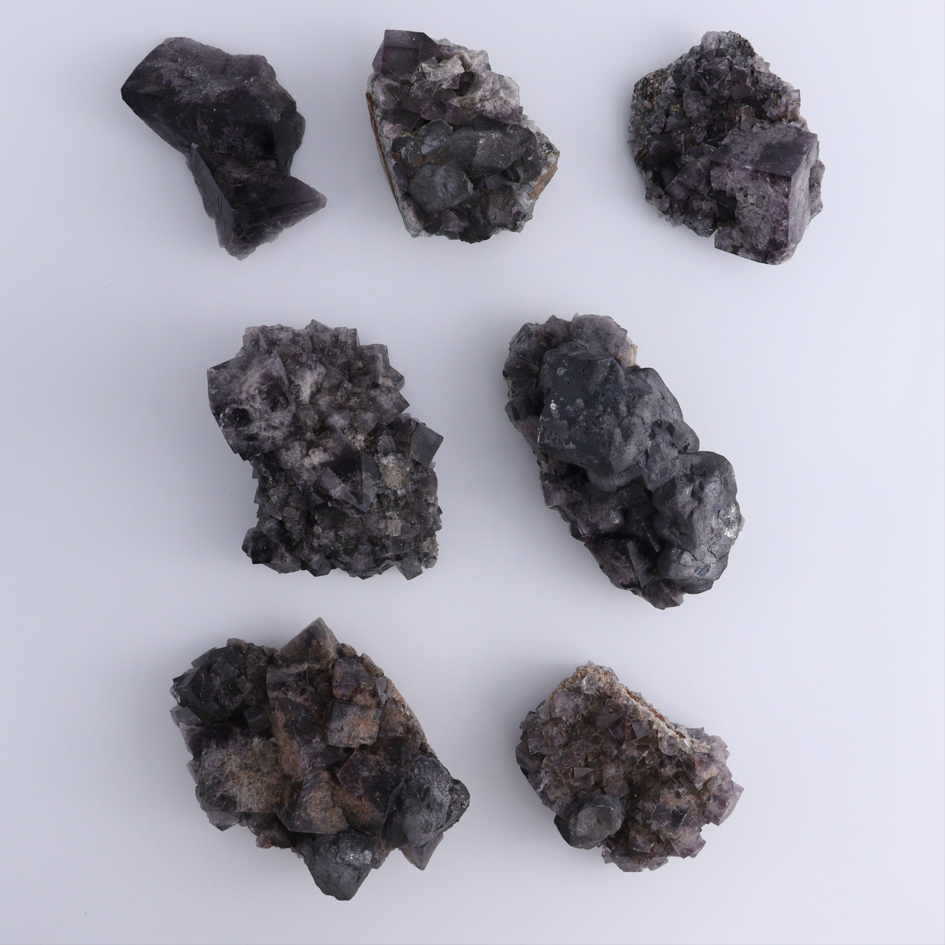 Fluorite Purple Rain Pocket Set of 7 - Expert Wholesale and Supplier of Wholesale Crystals & Bulk Gemstones, ["close_50","England","Fluorite","Purple Rain Pocket","Rough"]