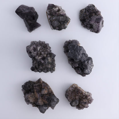 Fluorite Purple Rain Pocket Set of 7 - Expert Wholesale and Supplier of Wholesale Crystals & Bulk Gemstones, ["close_50","England","Fluorite","Purple Rain Pocket","Rough"]