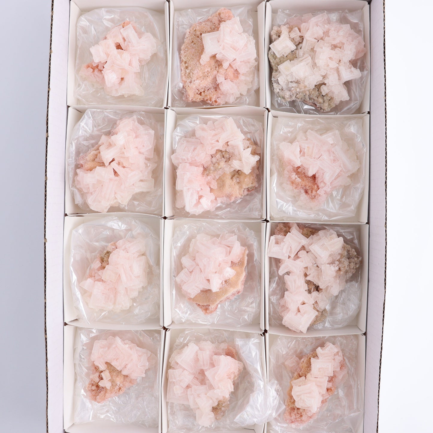 Searles Lake Halite Flat of 12 - Expert Wholesale and Supplier of Wholesale Crystals & Bulk Gemstones, ["close_30","Halite","Pink Halite","United States"]