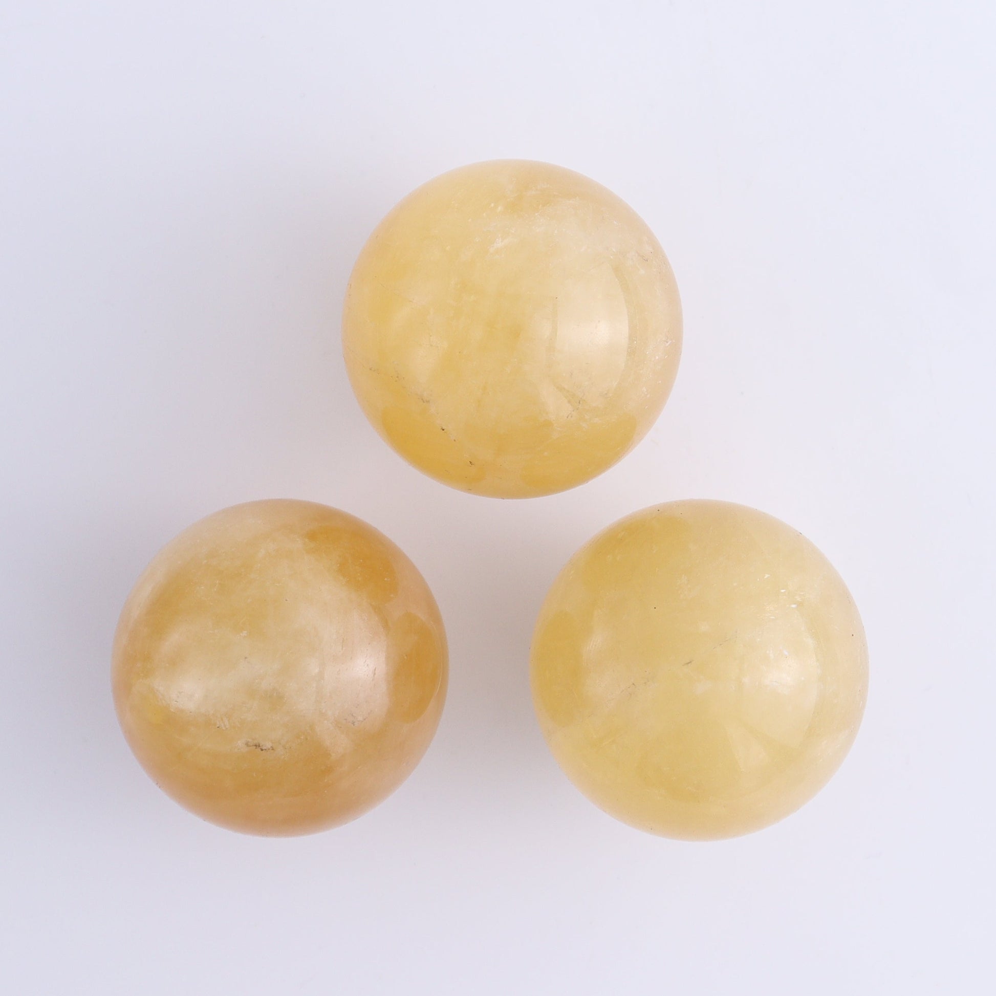 Calcite Spheres Set of 9 - Expert Wholesale and Supplier of Wholesale Crystals & Bulk Gemstones, ["Calcite","Mexico","Spheres"]