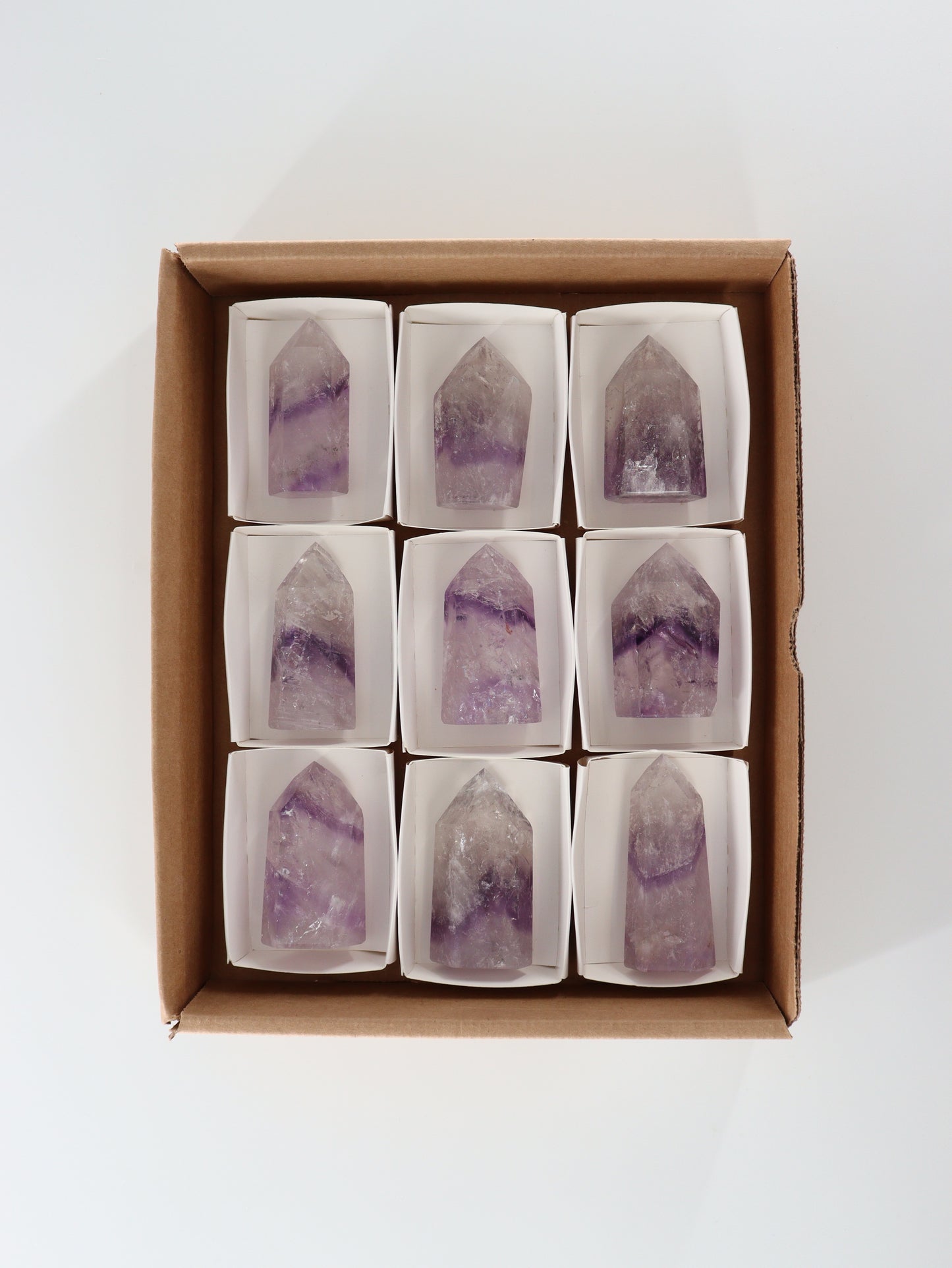 Phantom Amethyst Towers Set of 9 - Expert Wholesale and Supplier of Wholesale Crystals & Bulk Gemstones, []