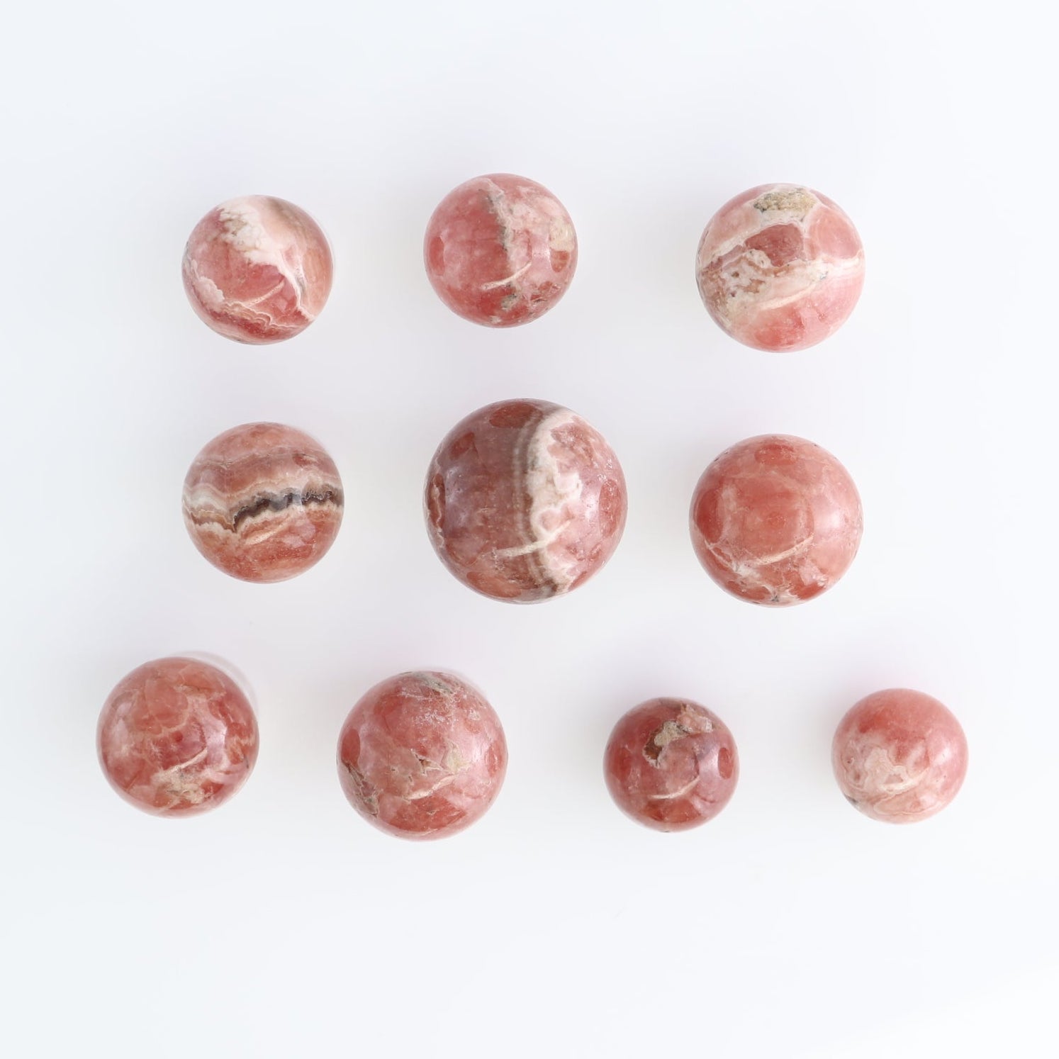 Rhodochrosite Spheres Set of 10 | Mi Esperanza Minerals | Supplier of Crystals and Onyx