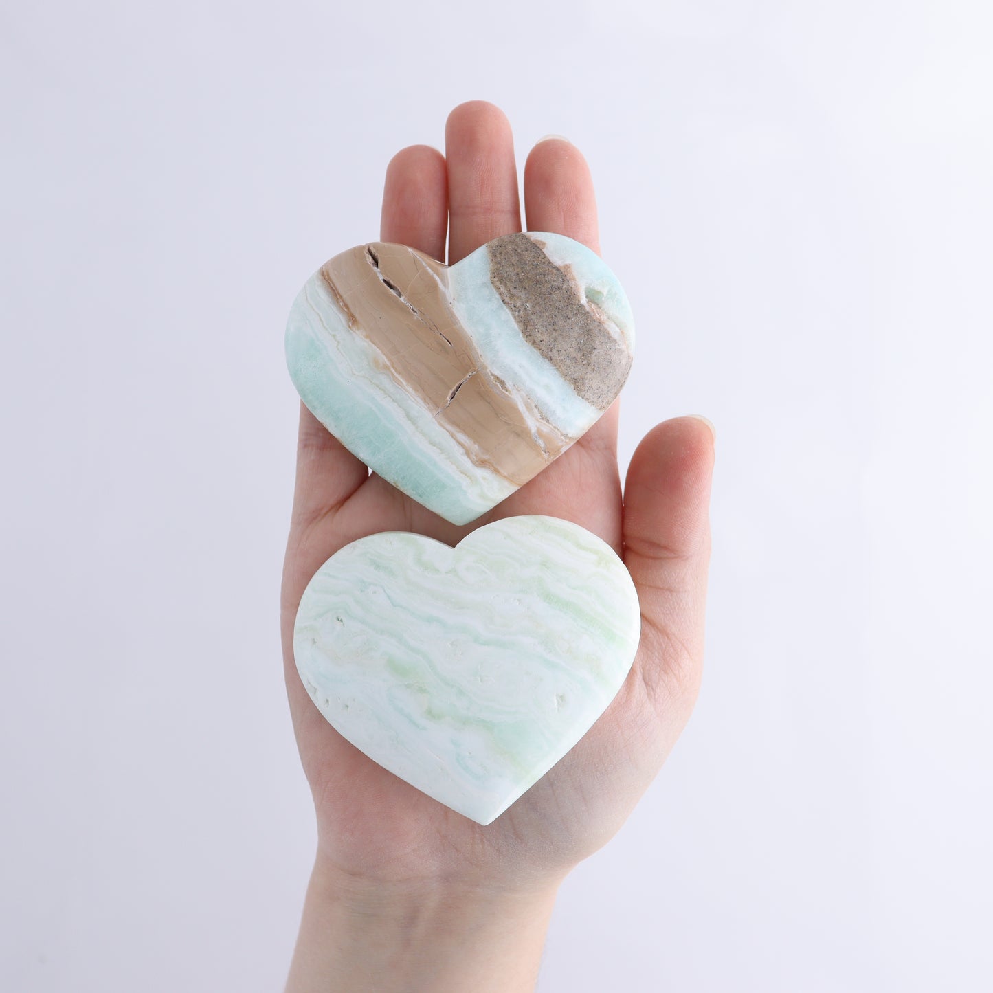 Caribbean Calcite Hearts Flat of 9 - Expert Wholesale and Supplier of Wholesale Crystals & Bulk Gemstones, ["Caribbean Calcite","Hearts","Madagascar"]