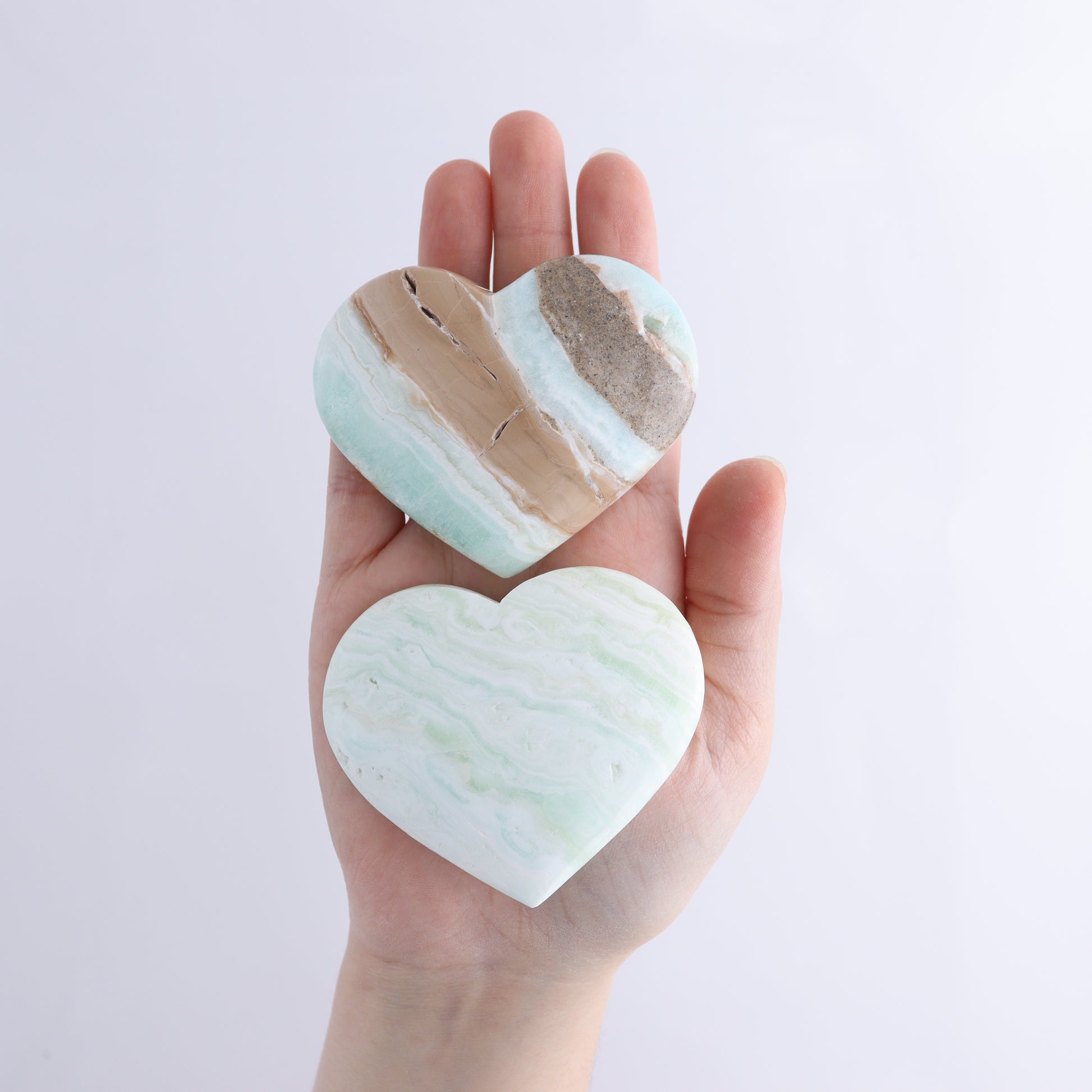 Caribbean Calcite Hearts Flat of 9 - Expert Wholesale and Supplier of Wholesale Crystals & Bulk Gemstones, ["Caribbean Calcite","Hearts","Madagascar"]