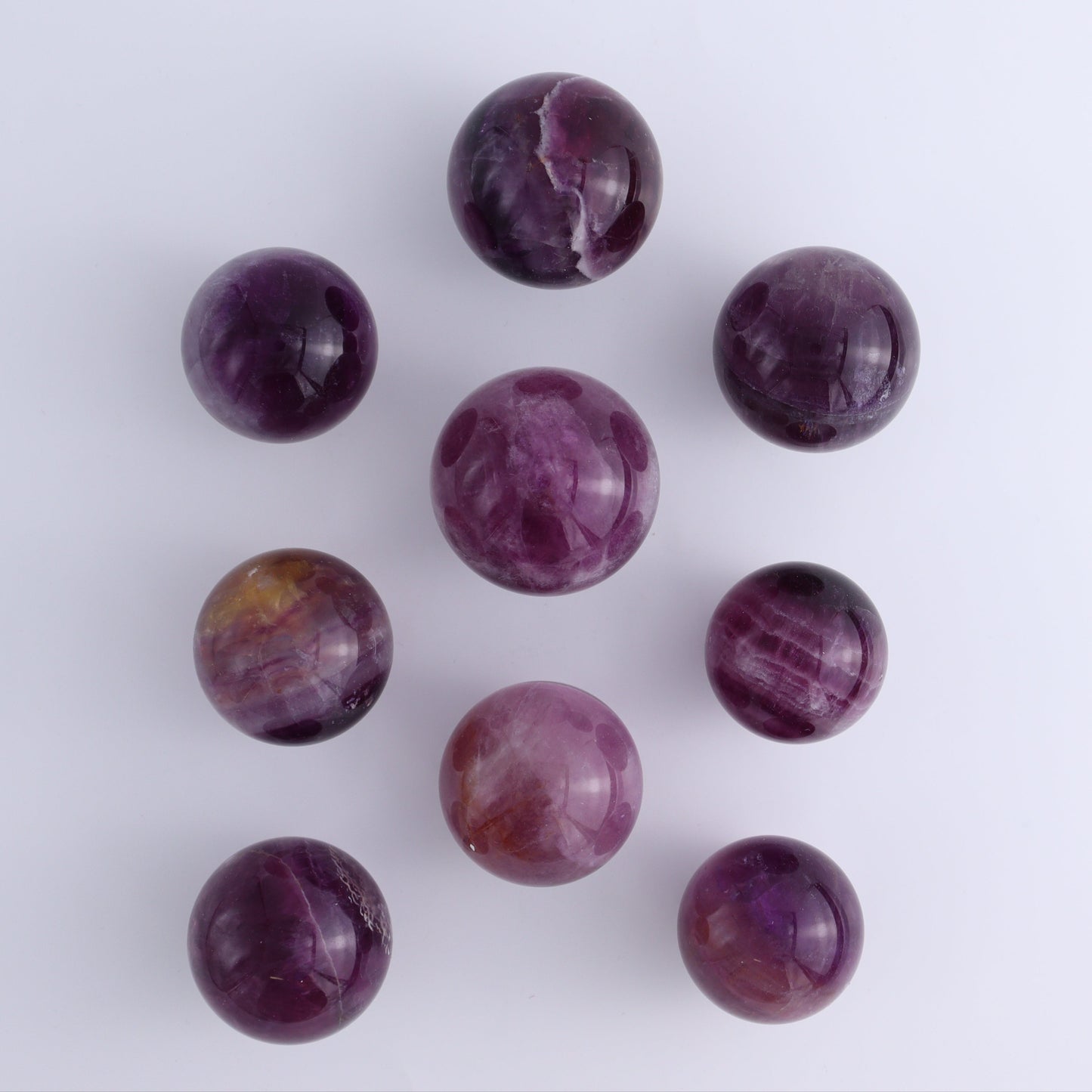 Purple Fluorite Spheres Set of 9 - Expert Wholesale and Supplier of Wholesale Crystals & Bulk Gemstones, ["Fluorite","Purple Fluorite","Spheres"]