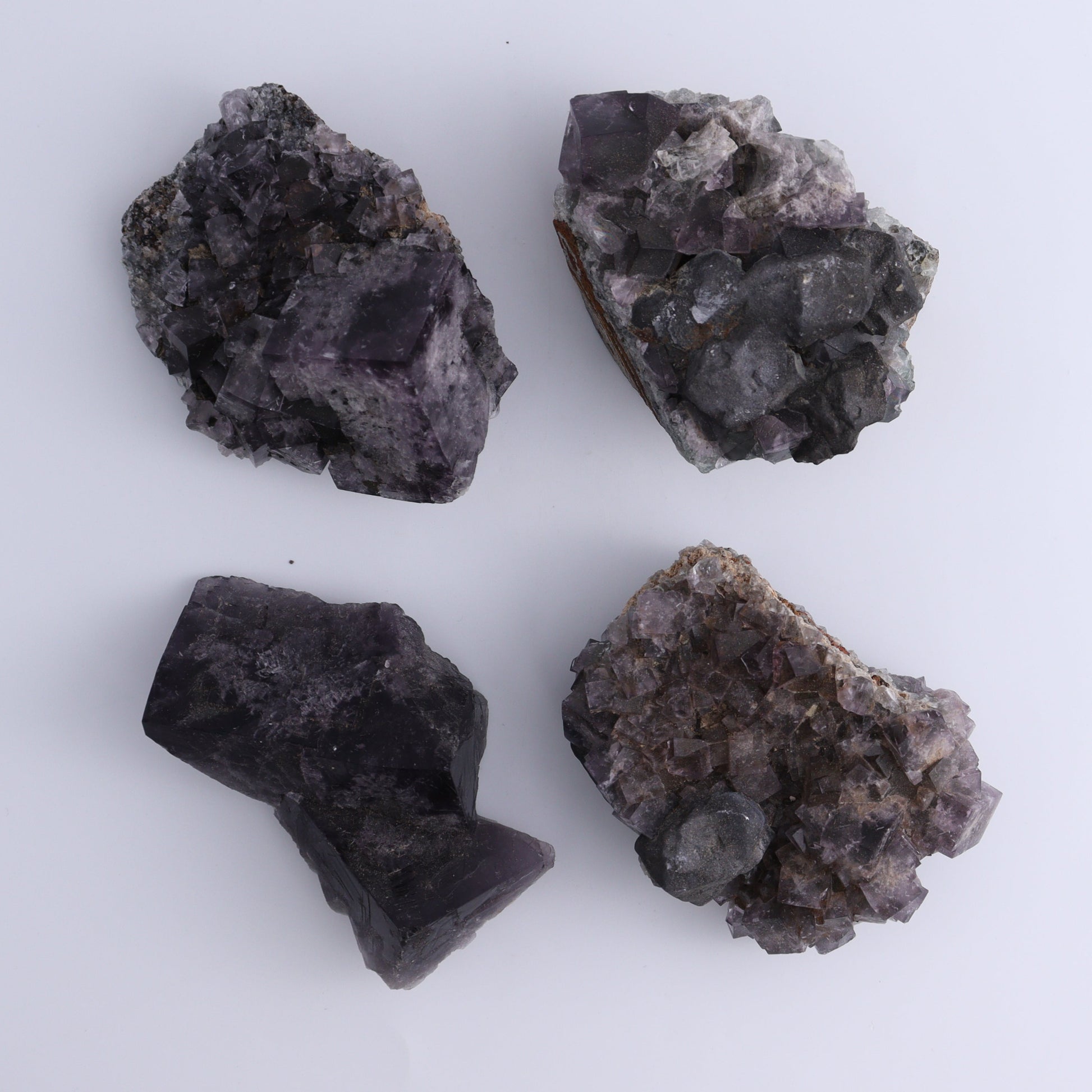 Fluorite Purple Rain Pocket Set of 7 - Expert Wholesale and Supplier of Wholesale Crystals & Bulk Gemstones, ["close_50","England","Fluorite","Purple Rain Pocket","Rough"]