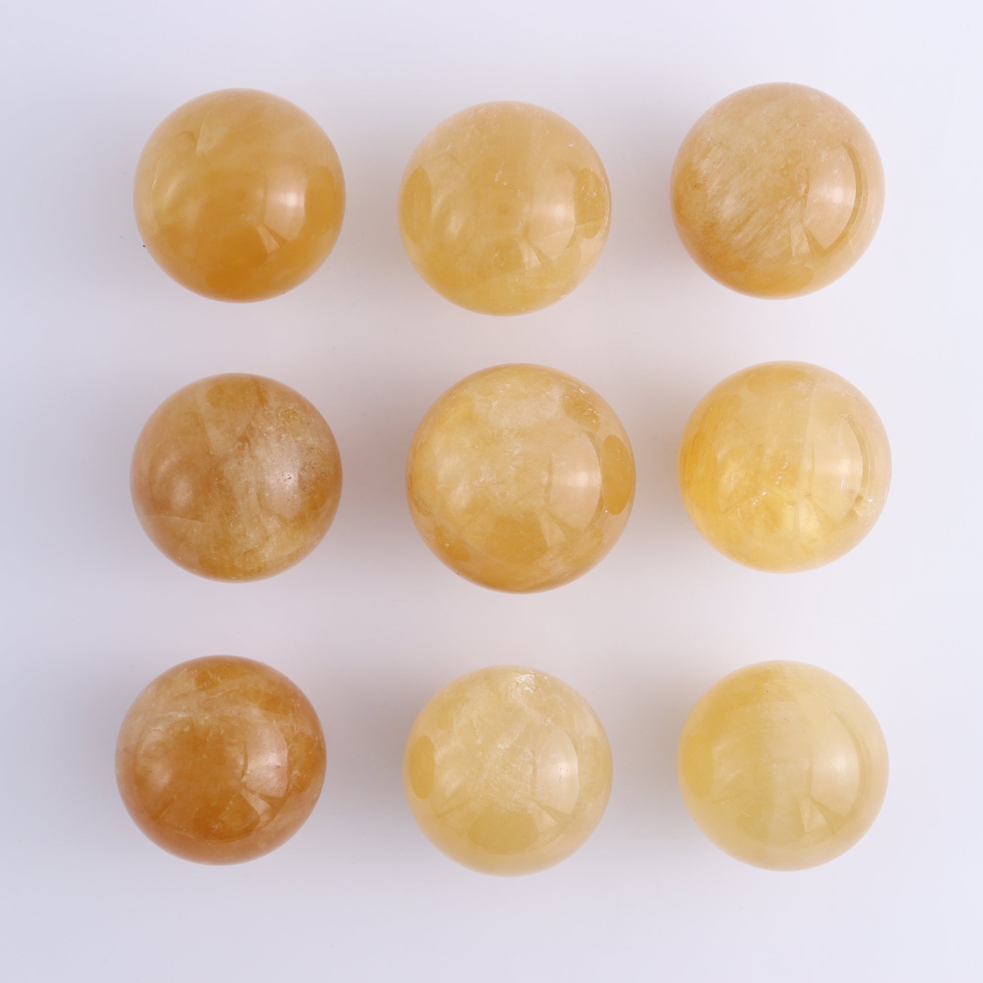 Calcite Spheres Set of 9 - Expert Wholesale and Supplier of Wholesale Crystals & Bulk Gemstones, ["Calcite","Mexico","Spheres"]