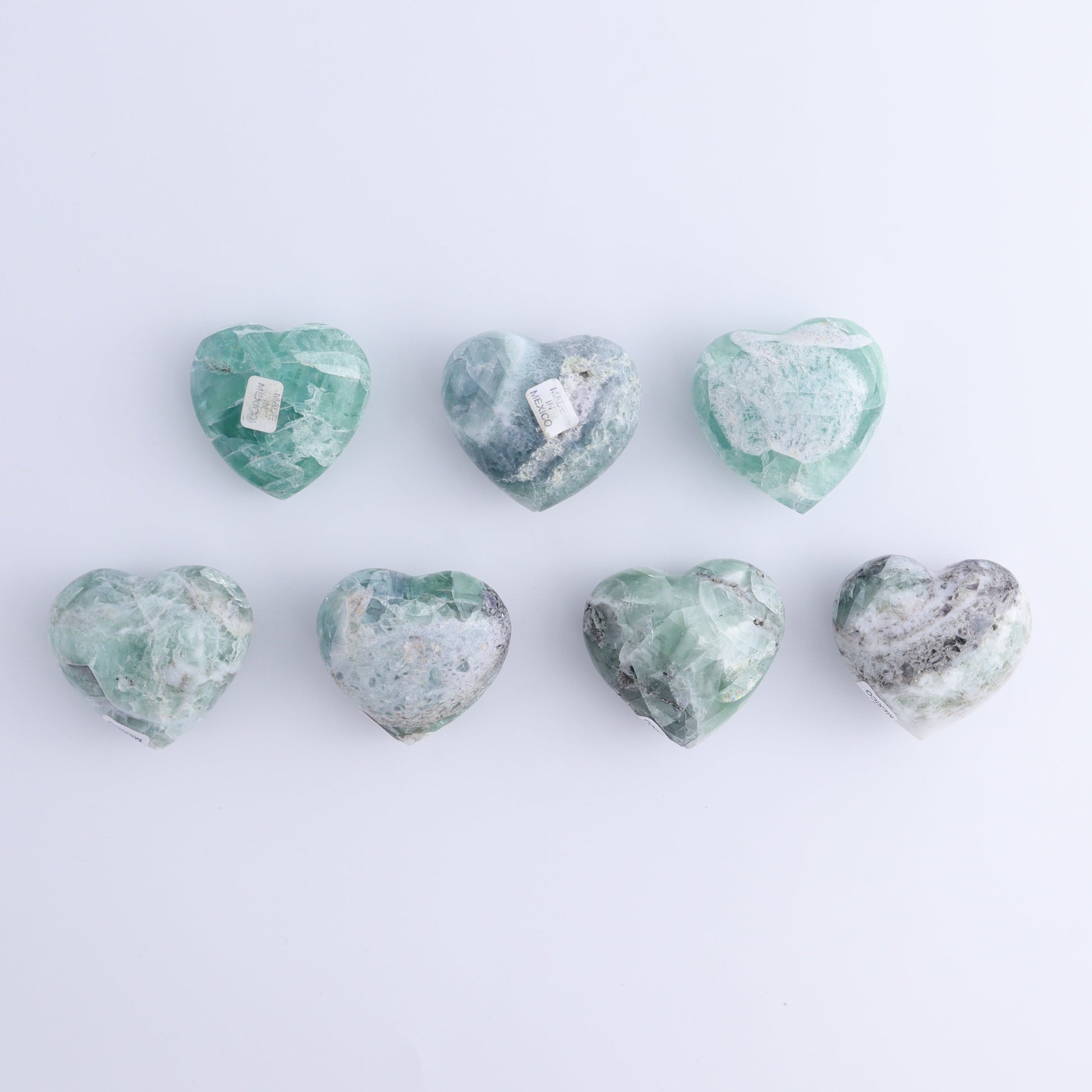 Fluorite Hearts Set of 7 - Expert Wholesale and Supplier of Wholesale Crystals & Bulk Gemstones, ["Fluorite","Hearts","Mexico"]