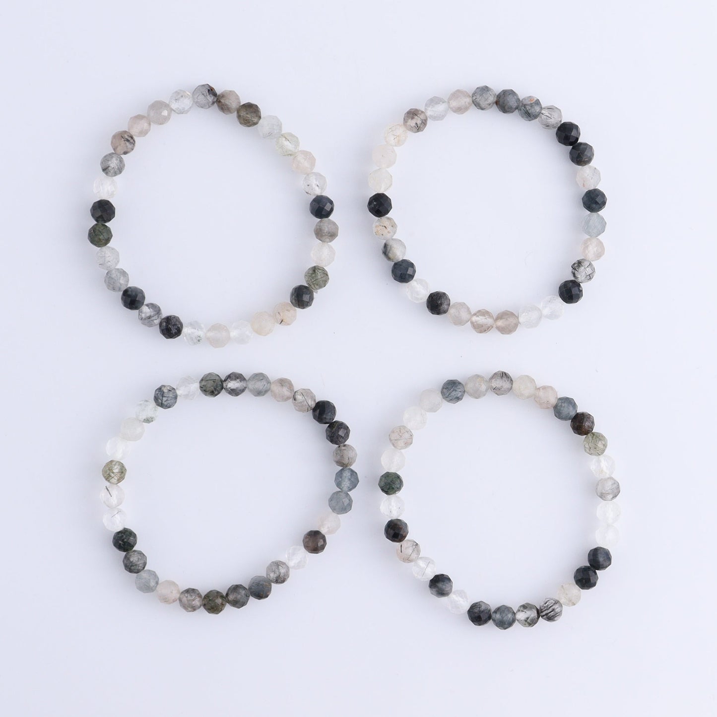 One Tourmaline in Quartz Faceted Bracelet - Expert Wholesale and Supplier of Wholesale Crystals & Bulk Gemstones, ["Bracelet","bracelets","Quartz","Tourmaline"]