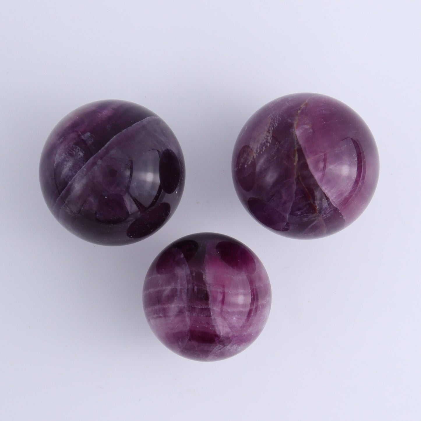 Purple Fluorite Spheres Set of 9 - Expert Wholesale and Supplier of Wholesale Crystals & Bulk Gemstones, ["Fluorite","Purple Fluorite","Spheres"]