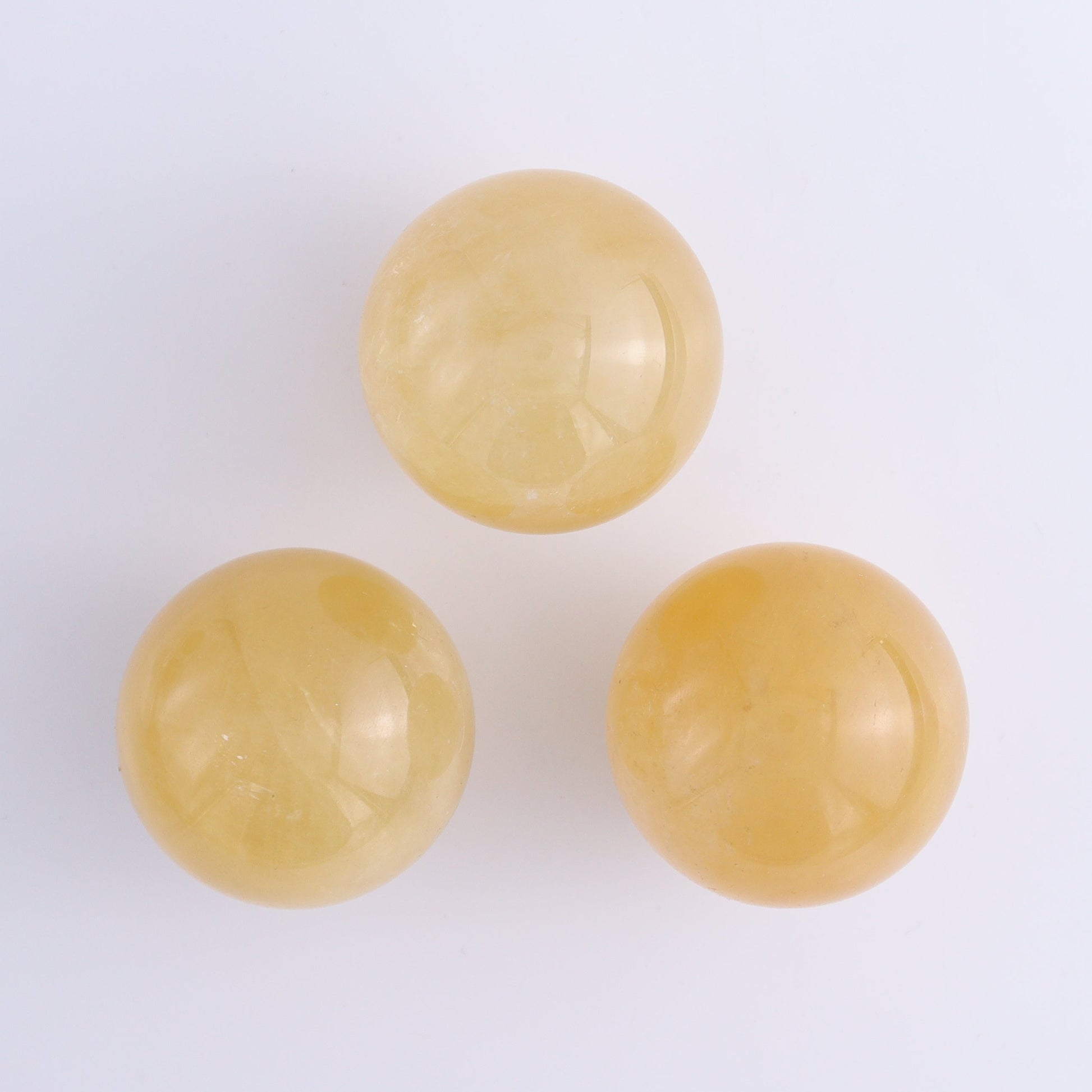 Calcite Spheres Set of 9 - Expert Wholesale and Supplier of Wholesale Crystals & Bulk Gemstones, ["Calcite","Mexico","Spheres"]