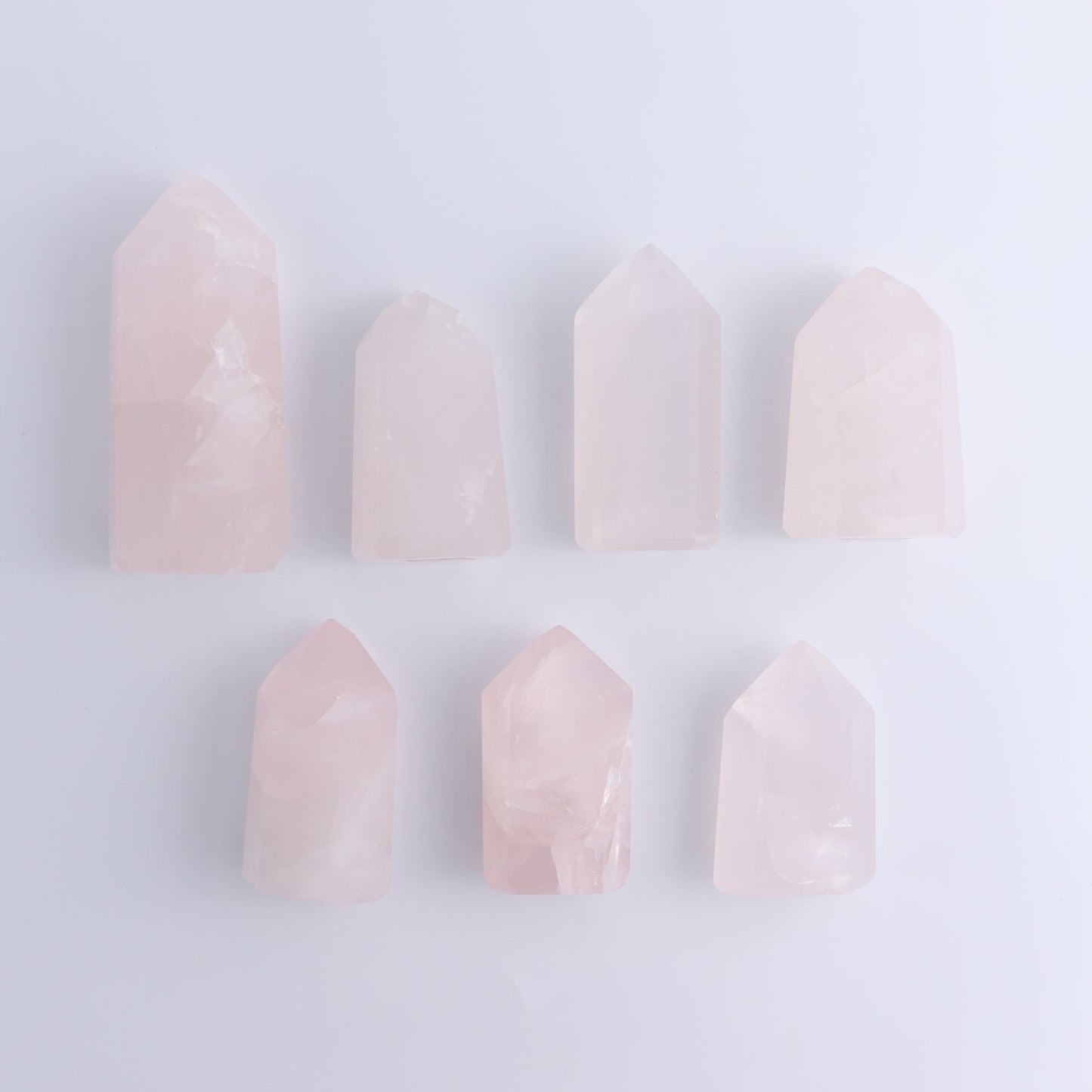 Imperfect Rose Quartz Towers Set of 7 - Expert Wholesale and Supplier of Wholesale Crystals & Bulk Gemstones, ["Brazil","Points","Quartz","Rose Quartz","Towers"]