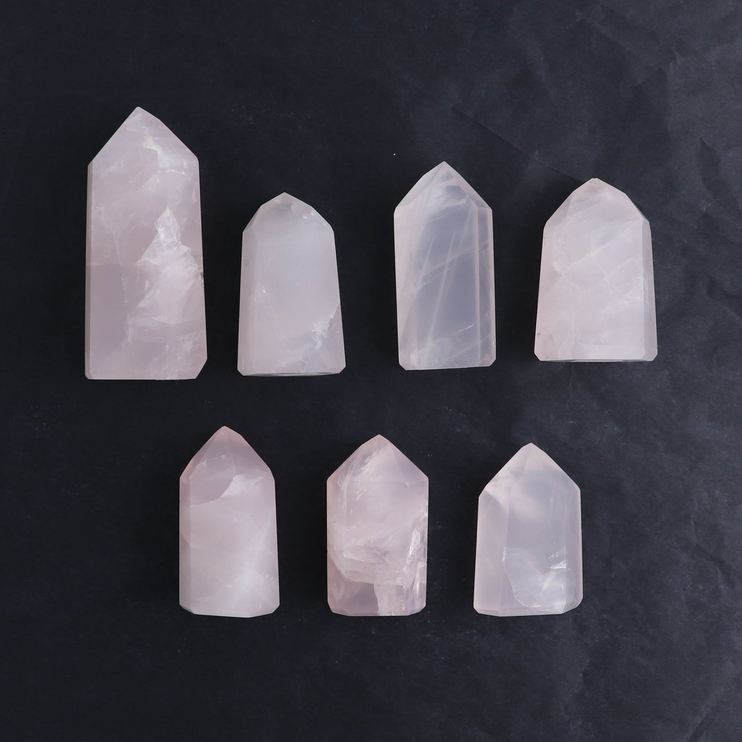 Imperfect Rose Quartz Towers Set of 7 - Expert Wholesale and Supplier of Wholesale Crystals & Bulk Gemstones, ["Brazil","Points","Quartz","Rose Quartz","Towers"]