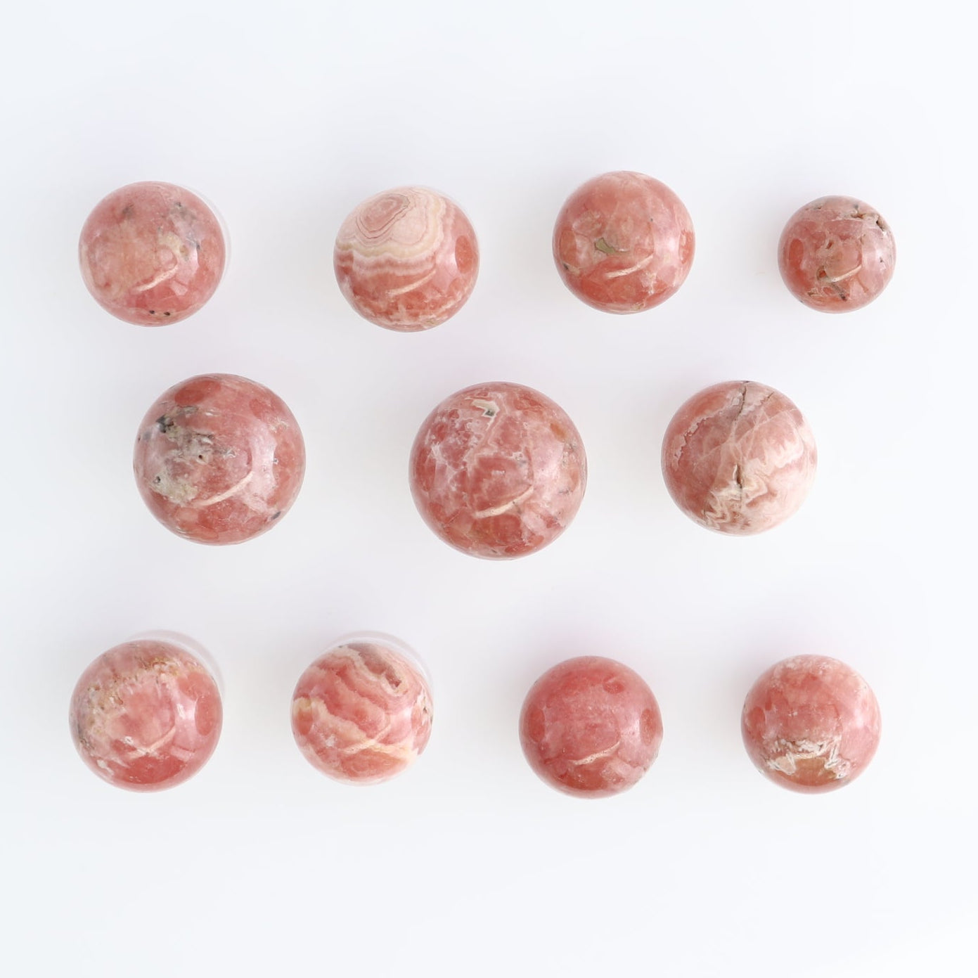 Rhodochrosite Spheres Set of 11 | Mi Esperanza Minerals | Supplier of Crystals and Onyx